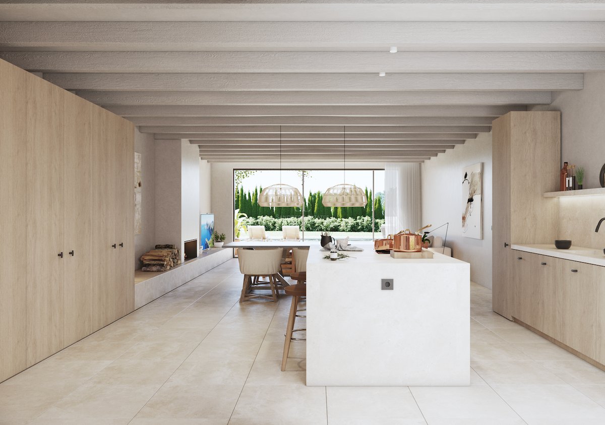 Cuisine contemporaine avec menuiserie en bois clair, îlot blanc et poutres au plafond s'ouvrant sur le jardin.