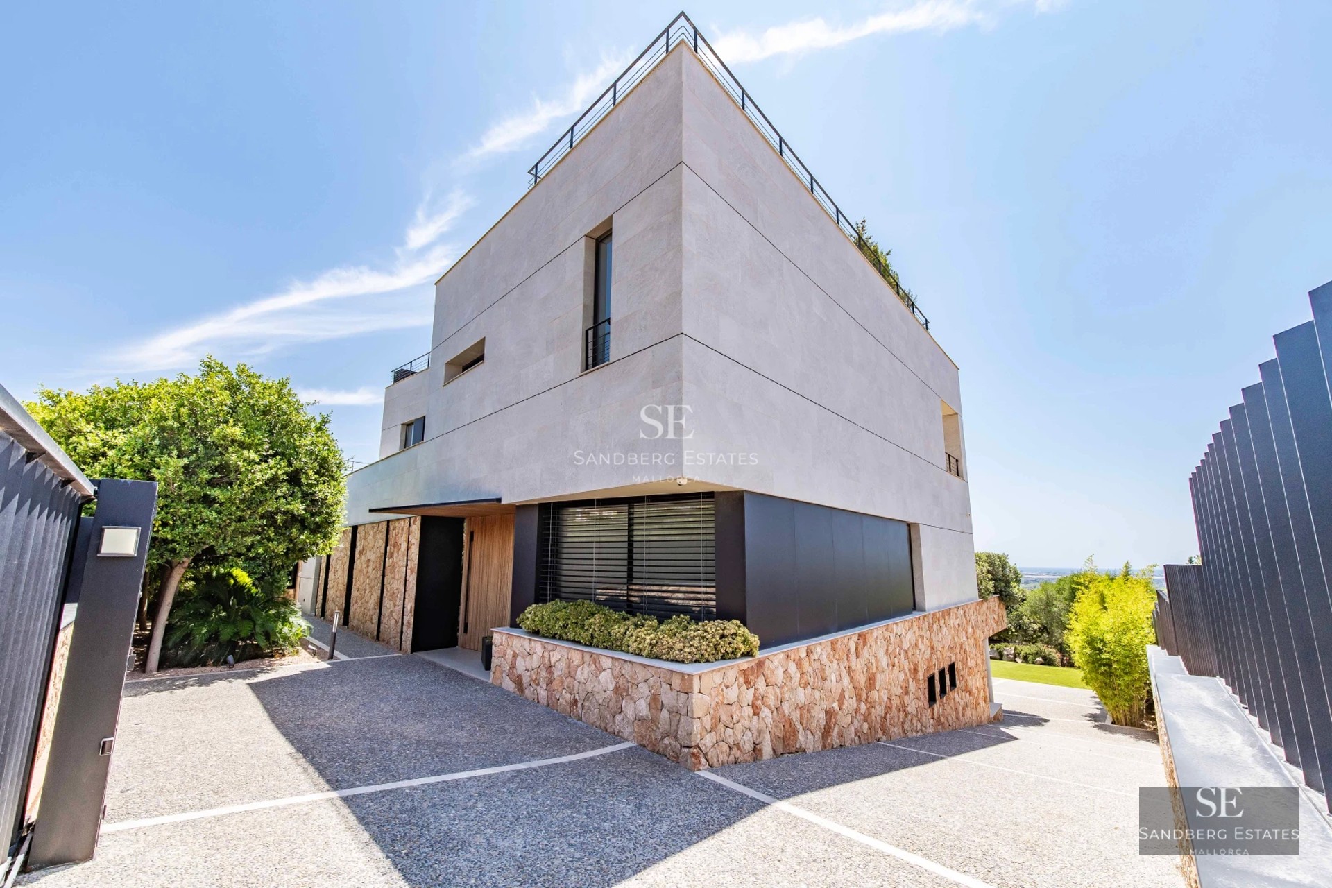 Bright living room with large windows offering panoramic sea views. Modern design, elegant furniture and neutral color palette.
