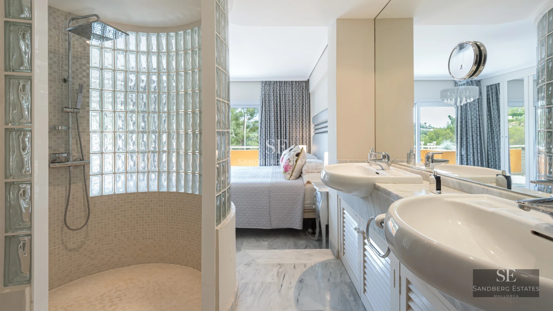 View of a luxurious infinity pool, surrounded by lawn and greenery. Modern architecture with large windows.