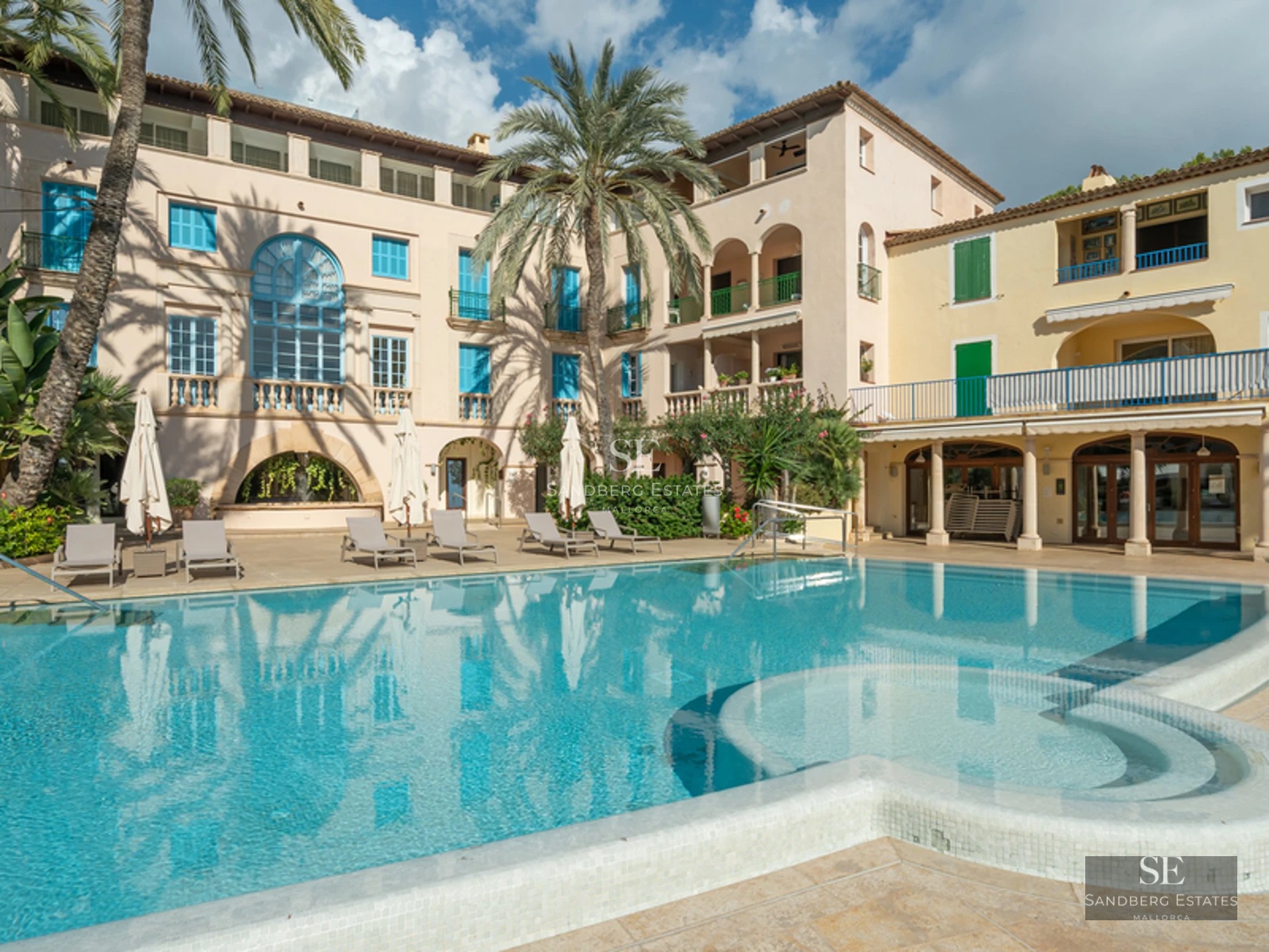 Expansive terrace featuring an infinity pool and ocean views. Modern design, stylish furniture, ambient lighting.