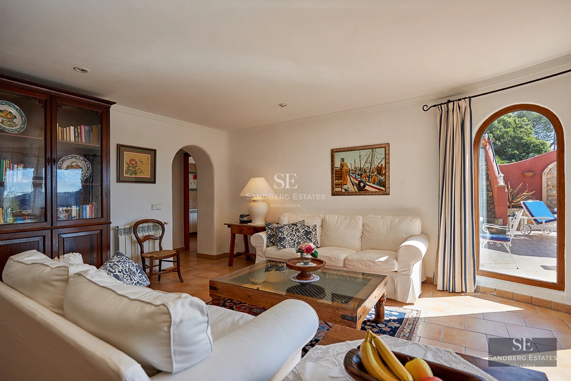 Spacious balcony with panoramic sea views. Modern design, glass railings, elegant and relaxing outdoor furniture.