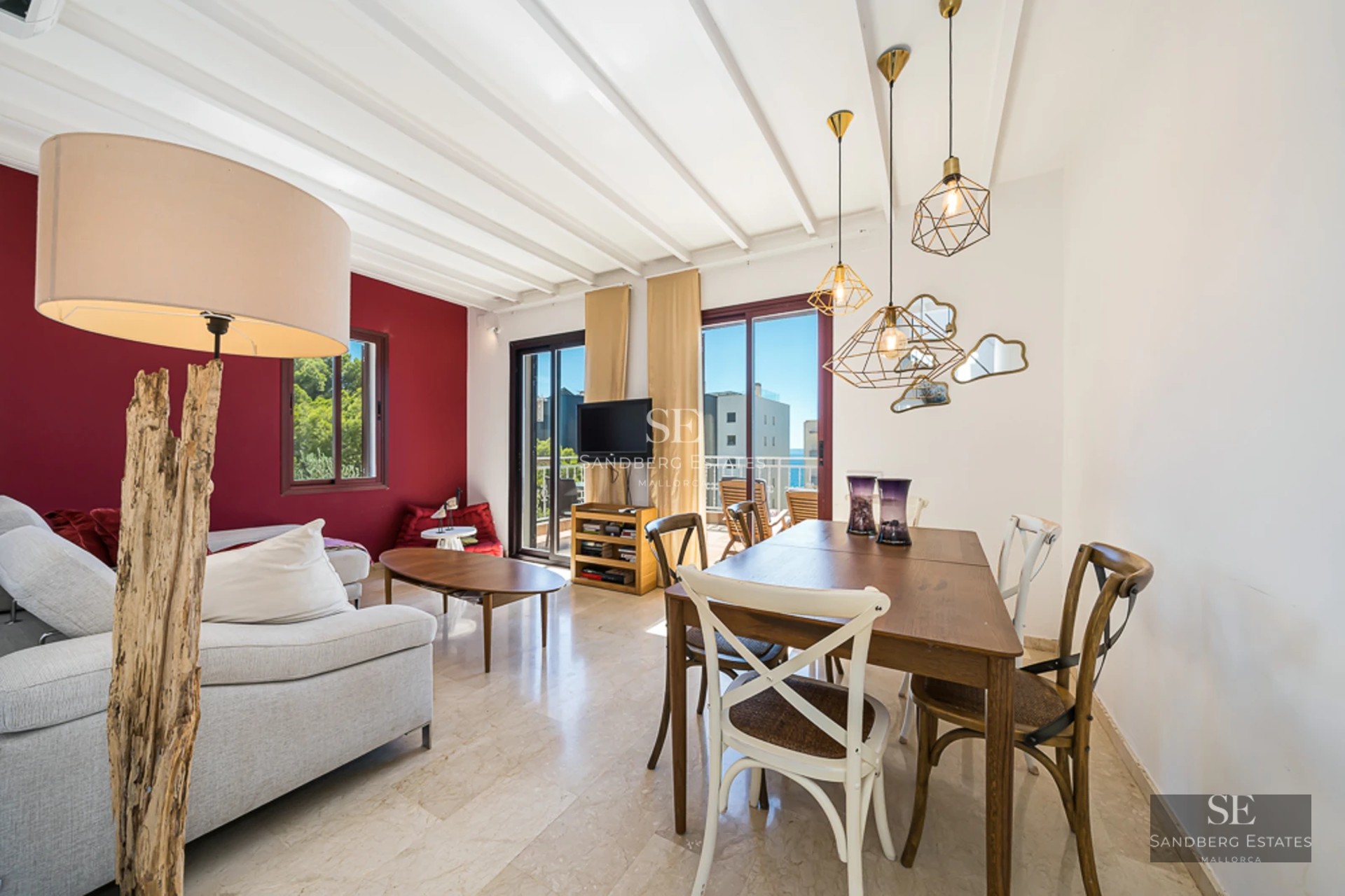 Spacious living room with balcony and panoramic sea views. Modern design, elegant furnishings and abundant natural light.