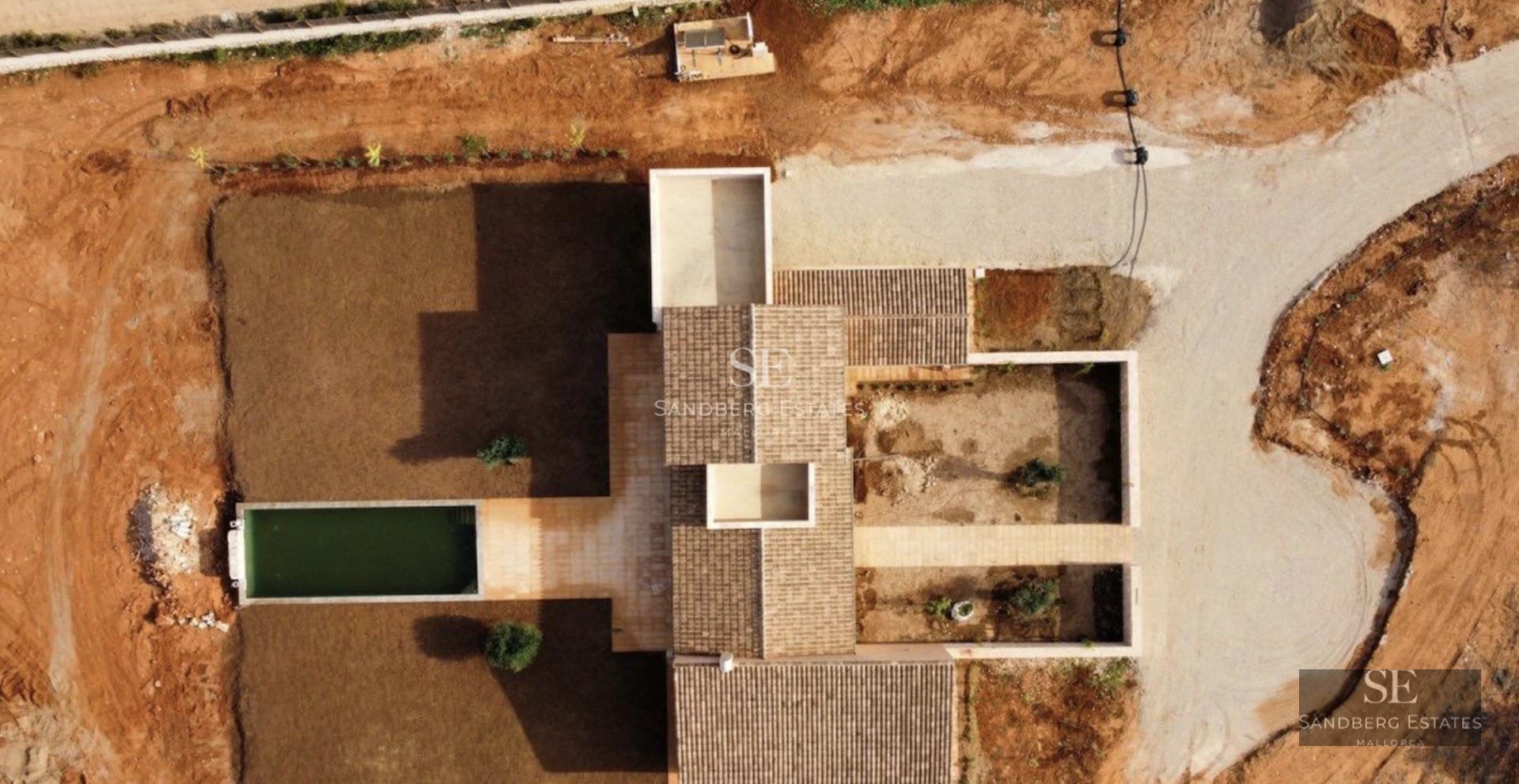 Spacious balcony with panoramic sea views. Elegant outdoor furniture, wooden flooring, and glass railing.