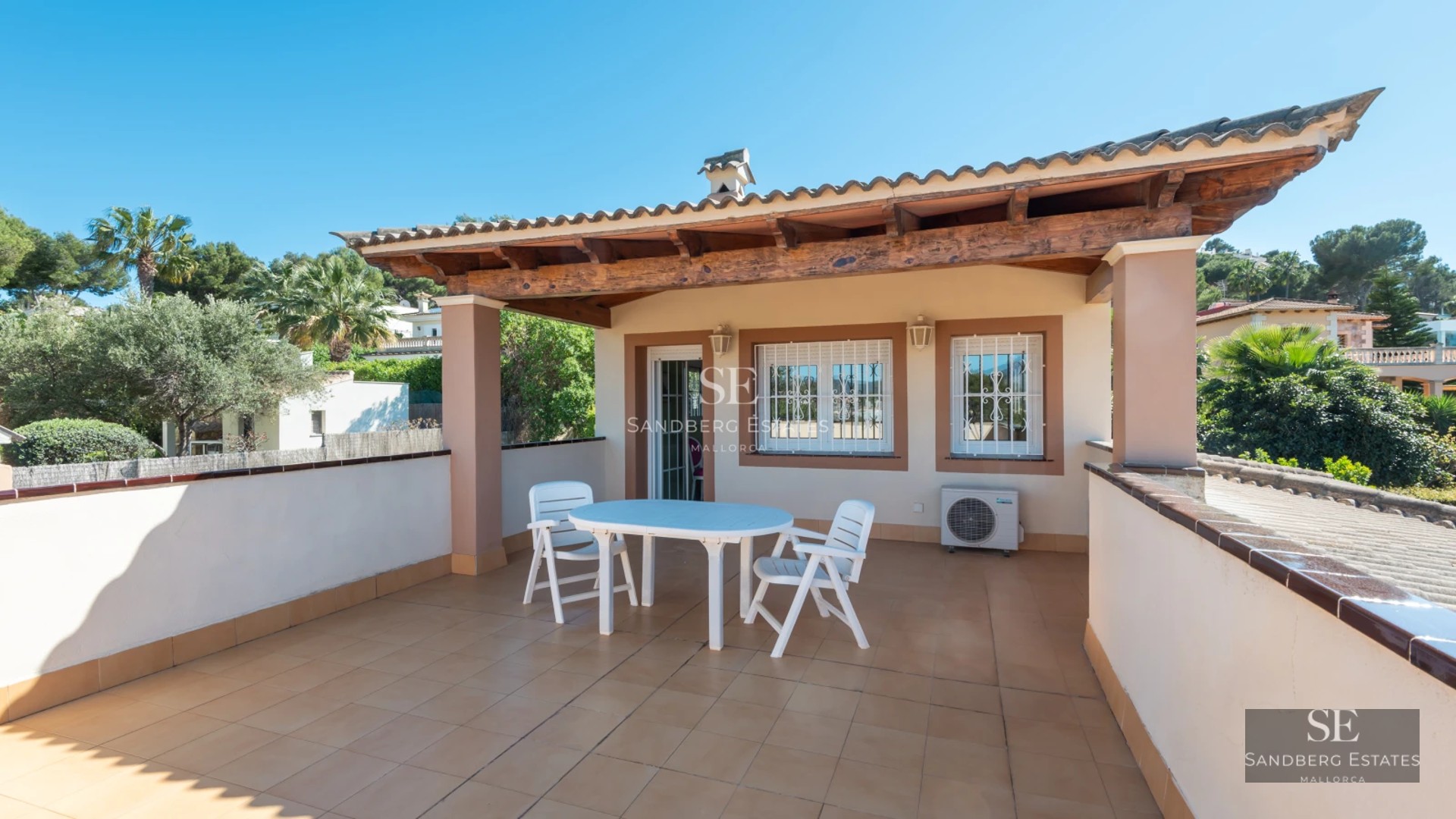 Spacious balcony with ocean views, modern outdoor furniture, and tiled flooring. Sleek and bright design.