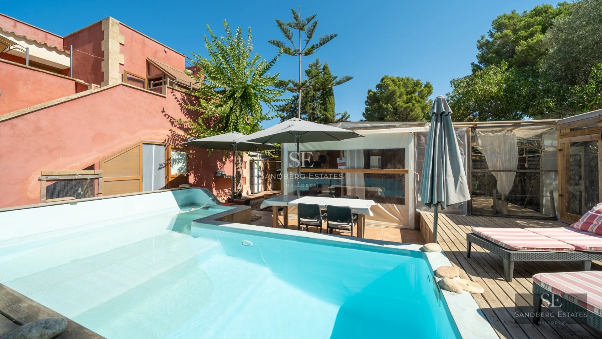 Exterior view of a modern house with pool, garden and large window front. Minimalist architecture with luxurious finishes.