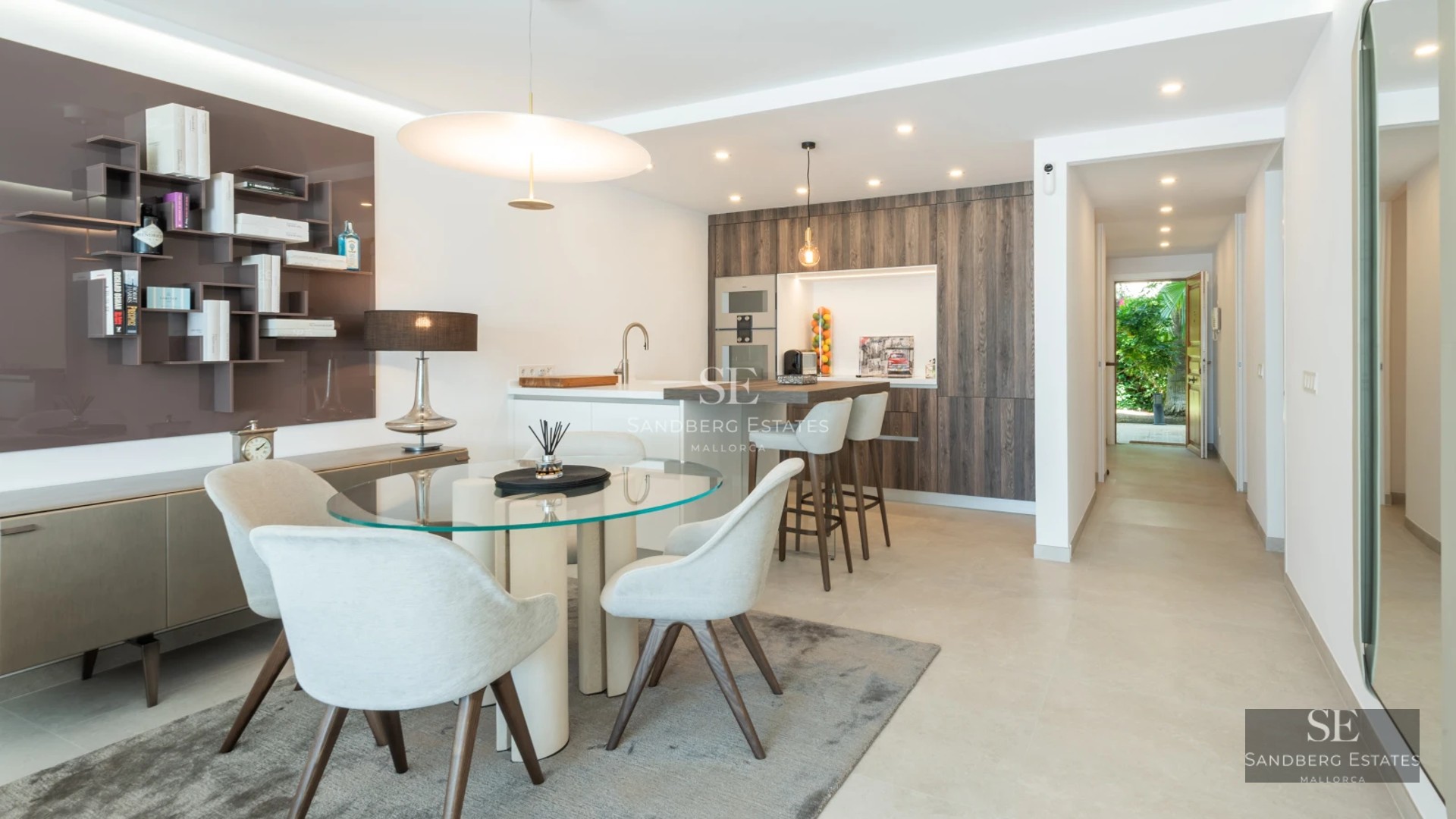 Exterior view of modern villa with infinity pool, expansive terraces, and minimalist architectural design in natural surroundings.