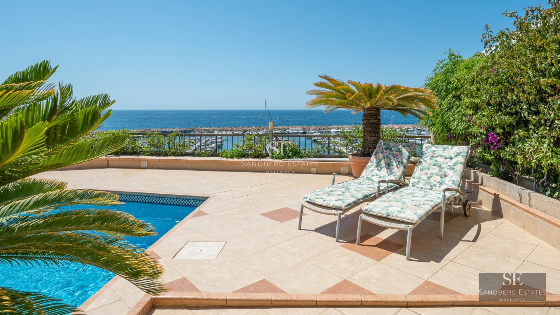 Modern exterior featuring a shimmering pool and contemporary architecture. Large windows and sleek design.