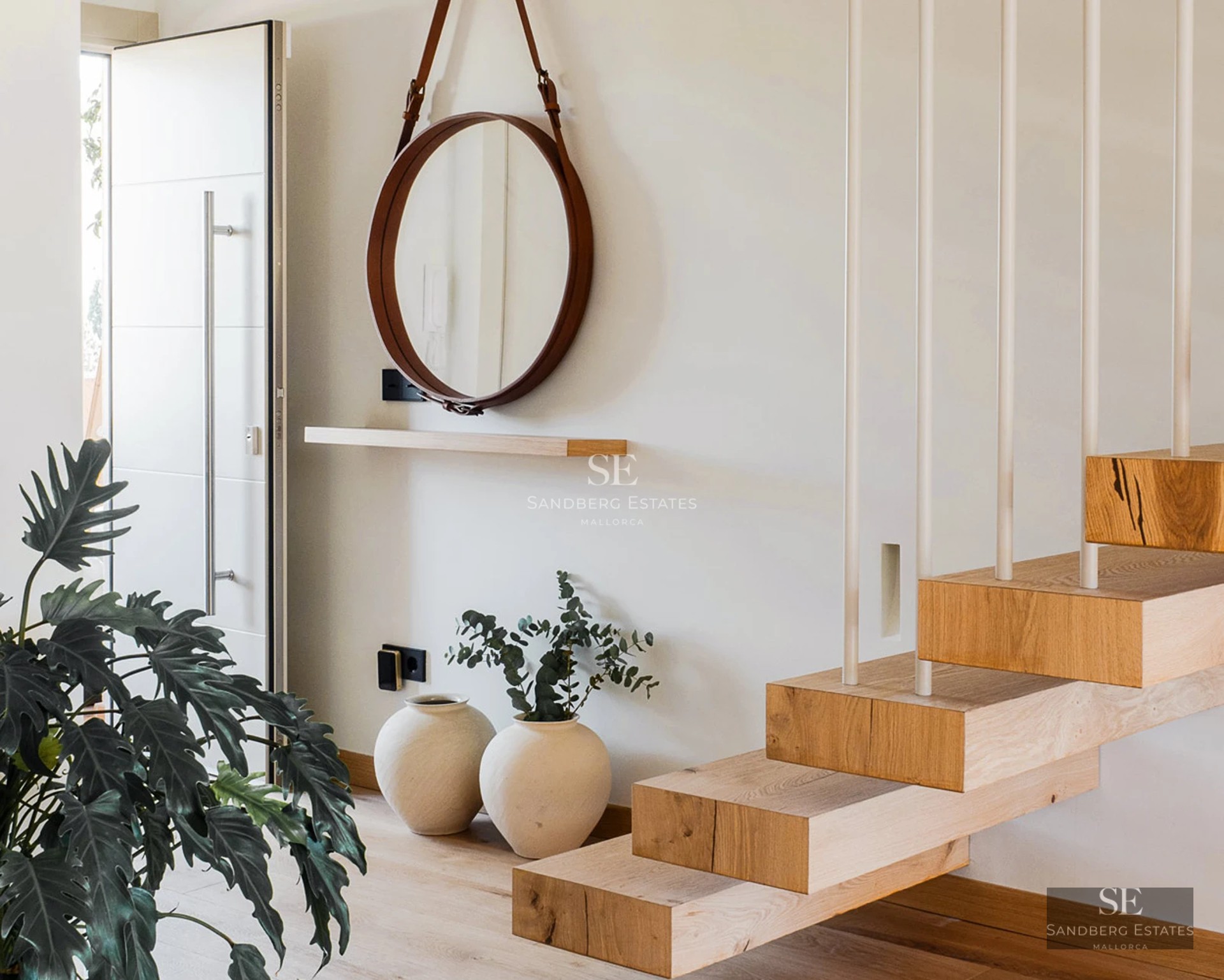 Exterior view of a modern villa featuring an infinity pool, spacious garden, and minimalist architectural design.