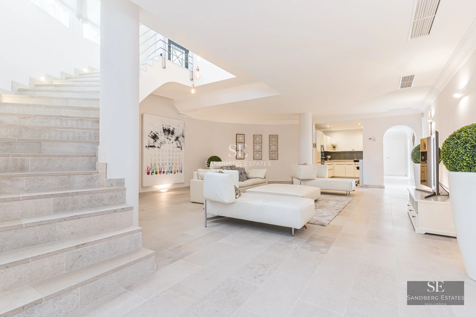 Modern interior with bright living room, large balcony, sea view, designer furniture, and high-quality finishes.