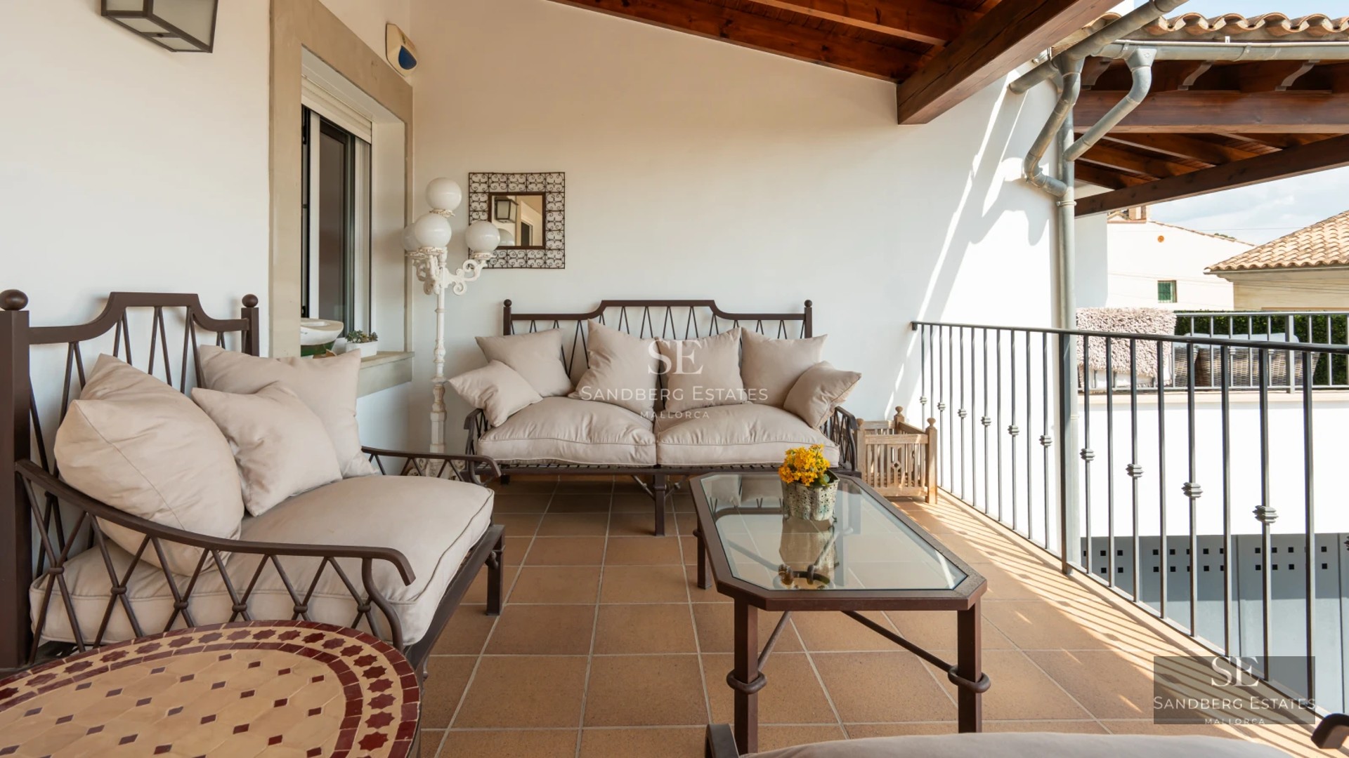 Spacious terrace with infinity pool and sea view. Modern design, elegant outdoor furniture and lush vegetation.