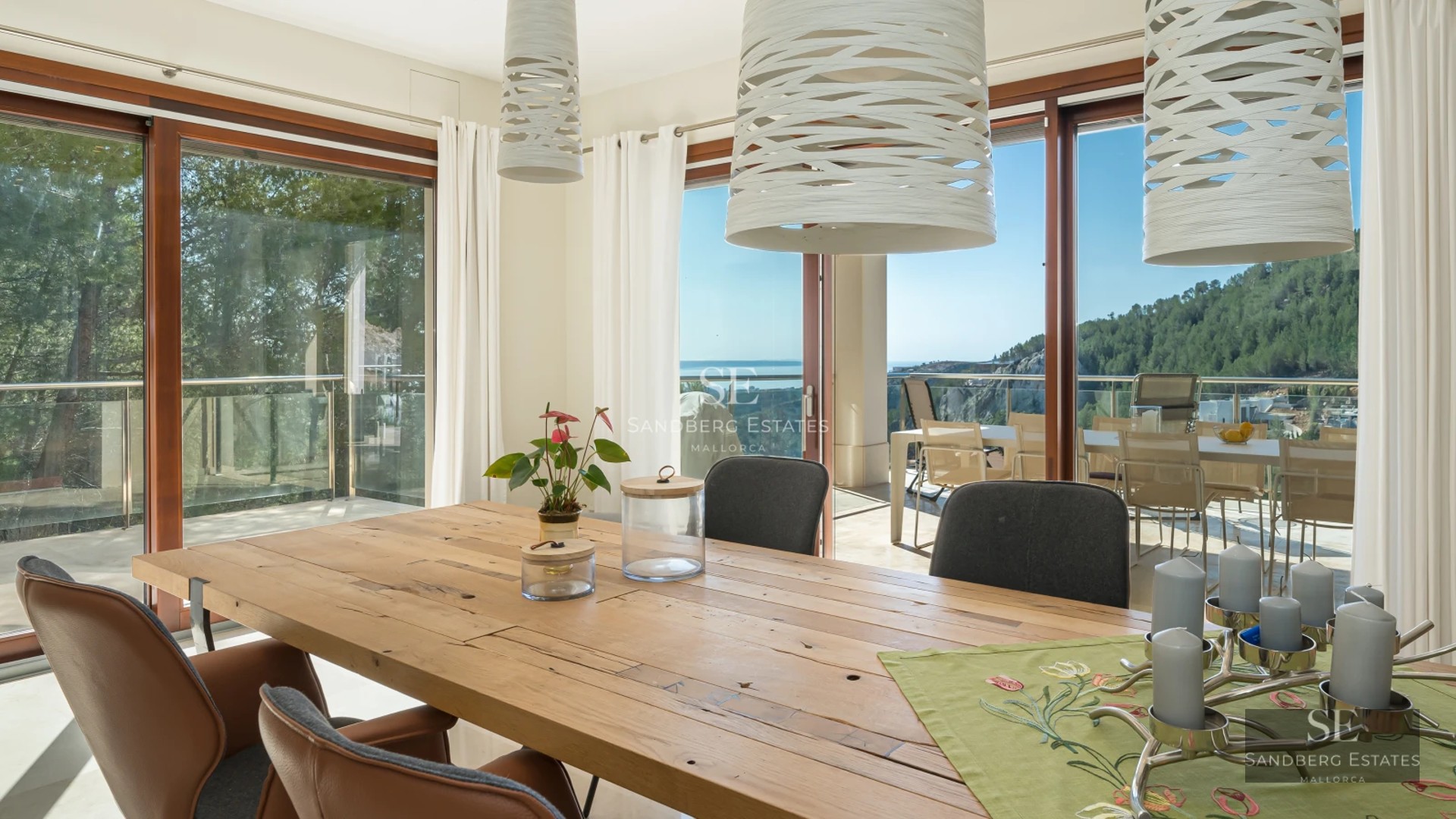 Exterior view of a modern villa with infinity pool, outdoor living area, and sea view. Sleek and minimalist design.