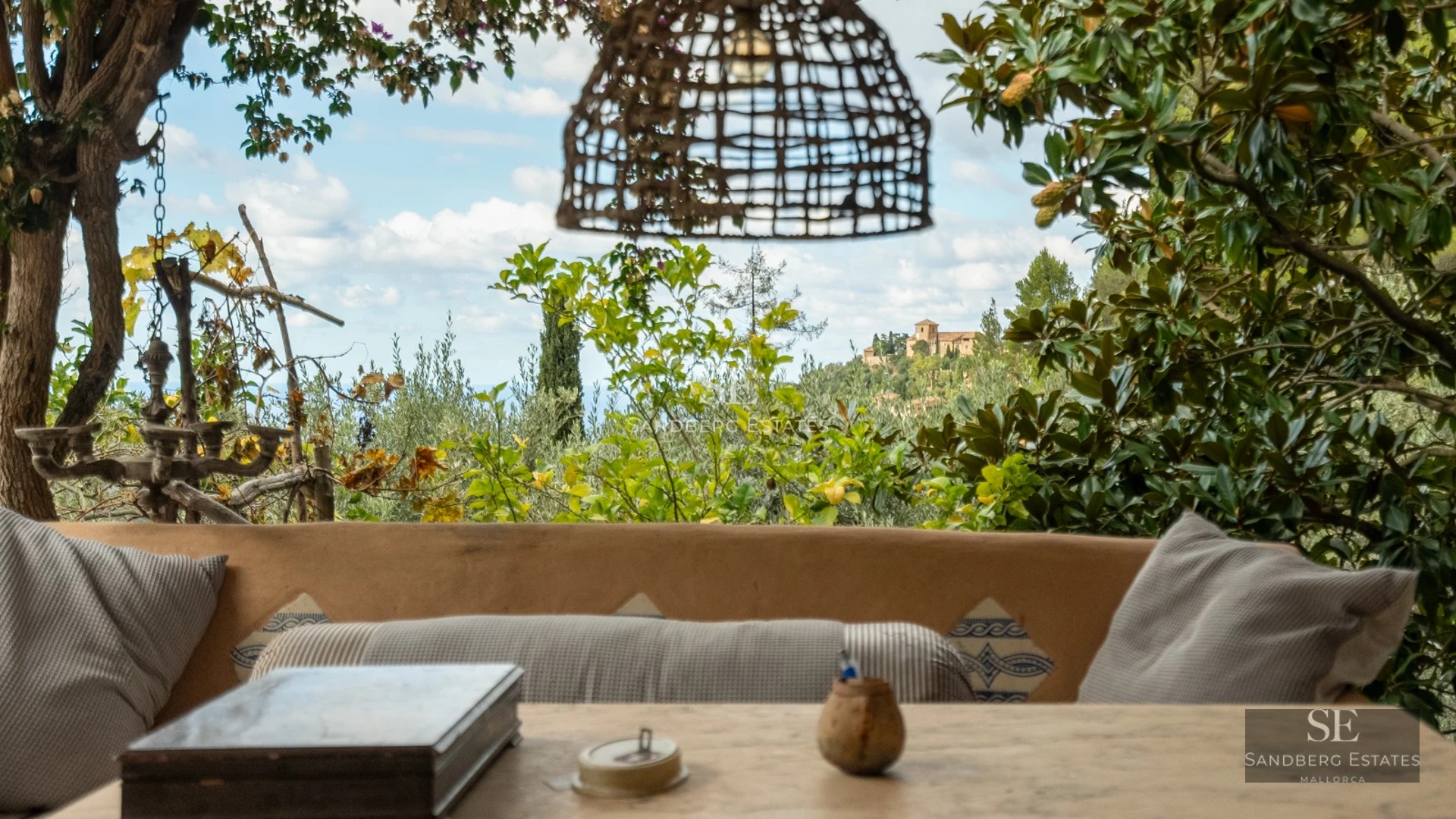 Bright, spacious living room featuring floor-to-ceiling sea view windows. Modern design with leather sofas, glass coffee table and wood flooring.