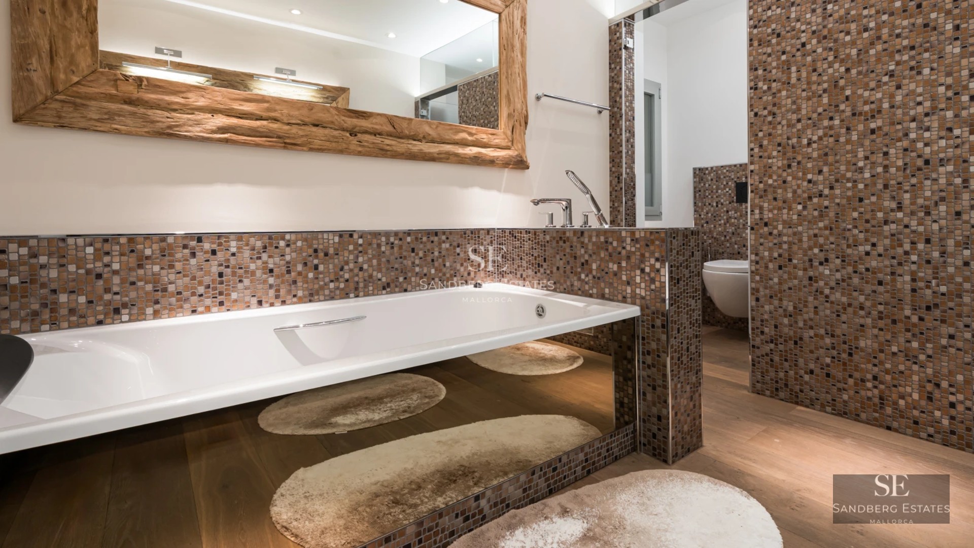 Aerial view of modern villa with pool, lush garden, and avant-garde architectural design. Natural light and high-quality finishes.