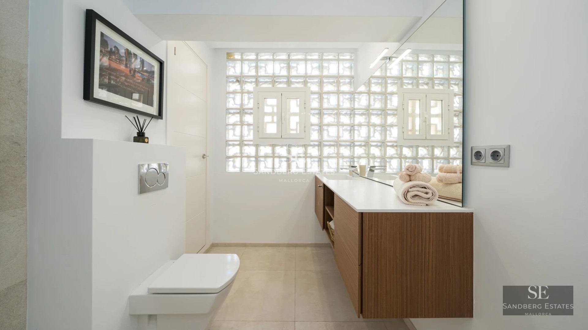 Exterior view of a modern villa with an infinity pool. Minimalist design, large windows, lush garden, and blue sky.