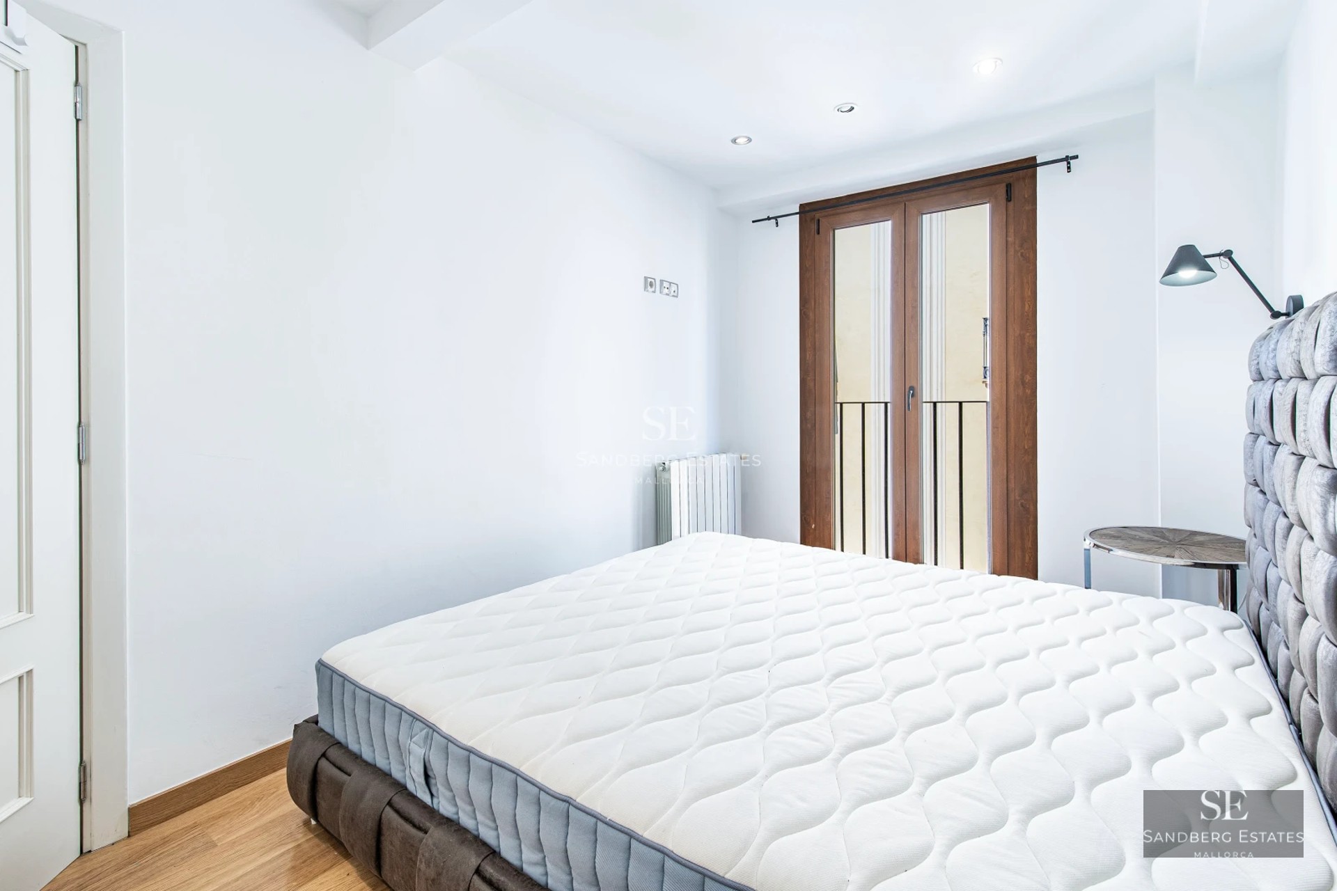 View of a modern villa with pool, sun loungers, outdoor living area, and lush gardens. Contemporary and luxurious design.