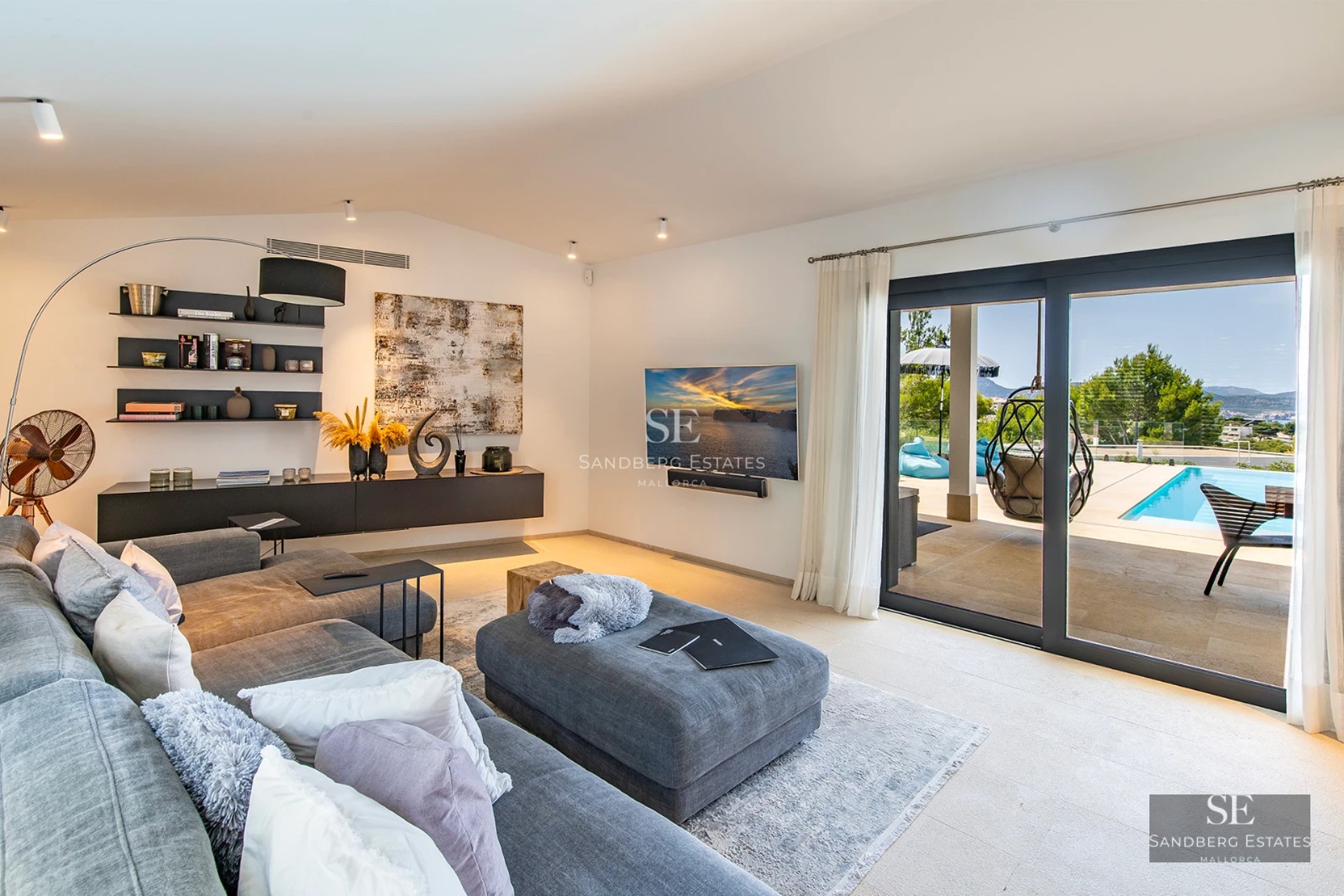 Exterior view of modern villa with infinity pool, lush garden, and spacious terraces. Minimalist design and high-end finishes.