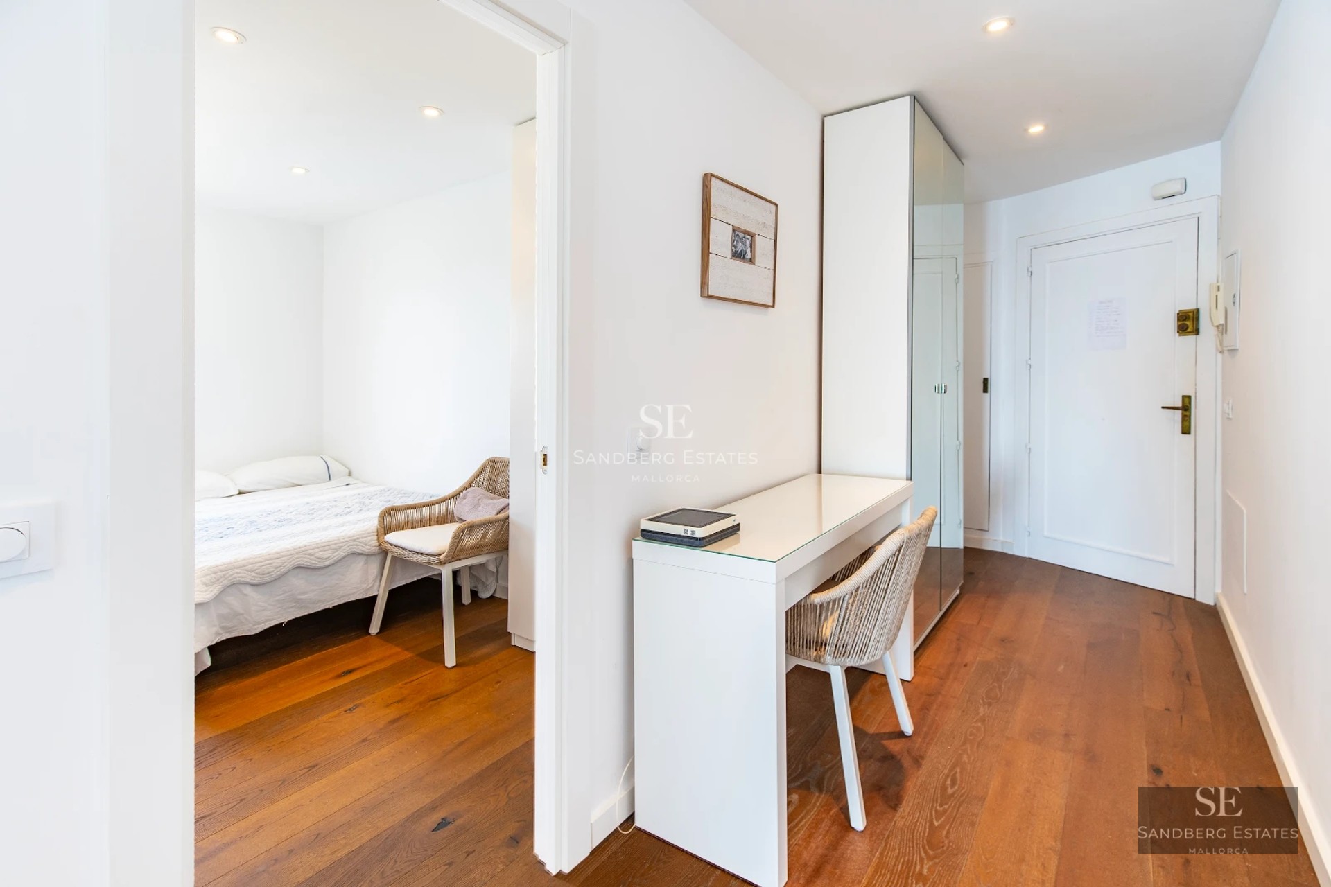 Exterior view of a modern villa with a pool, garden, and large windows reflecting sunlight. Minimalist and elegant design.