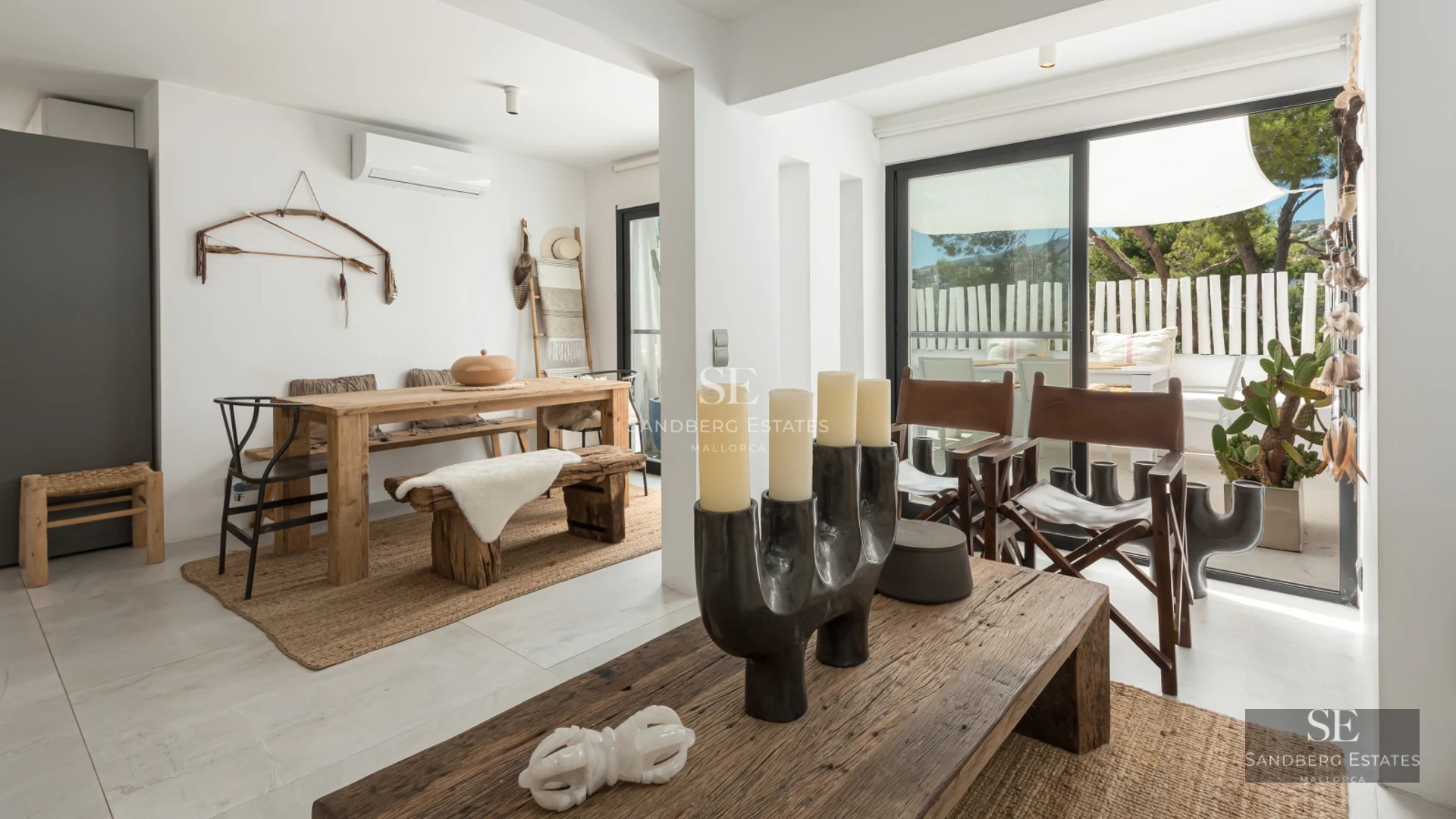 Exterior view of a luxurious villa featuring a pool, lush garden, and modern architecture. Warm lighting and large windows.