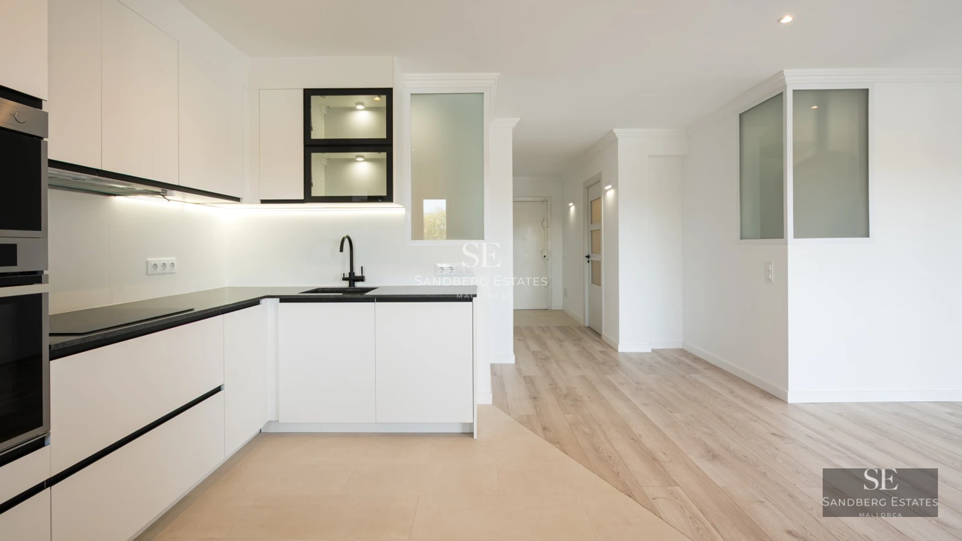 View of a modern pool with sundeck overlooking a lush garden. Minimalist architecture with large windows.