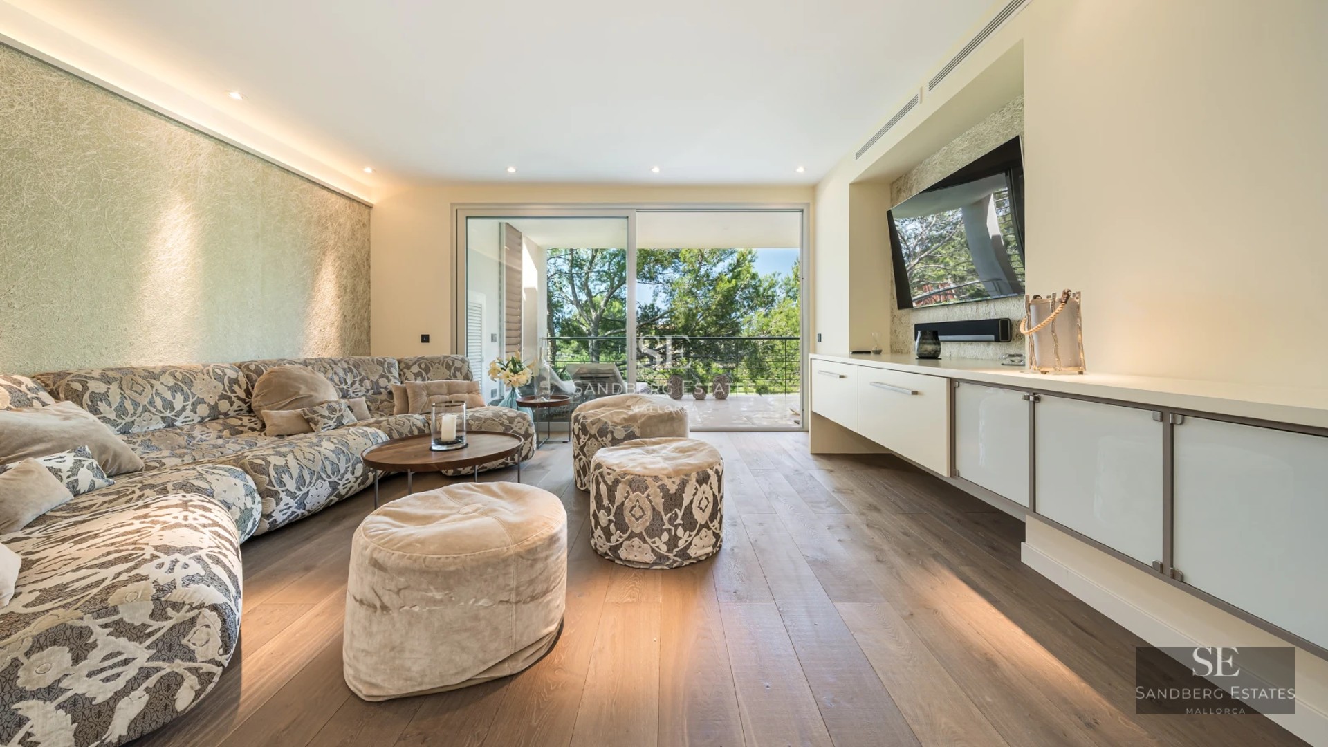 View of a luxurious pool with garden and an elegant modern home. Minimalist design features large windows and lush greenery.