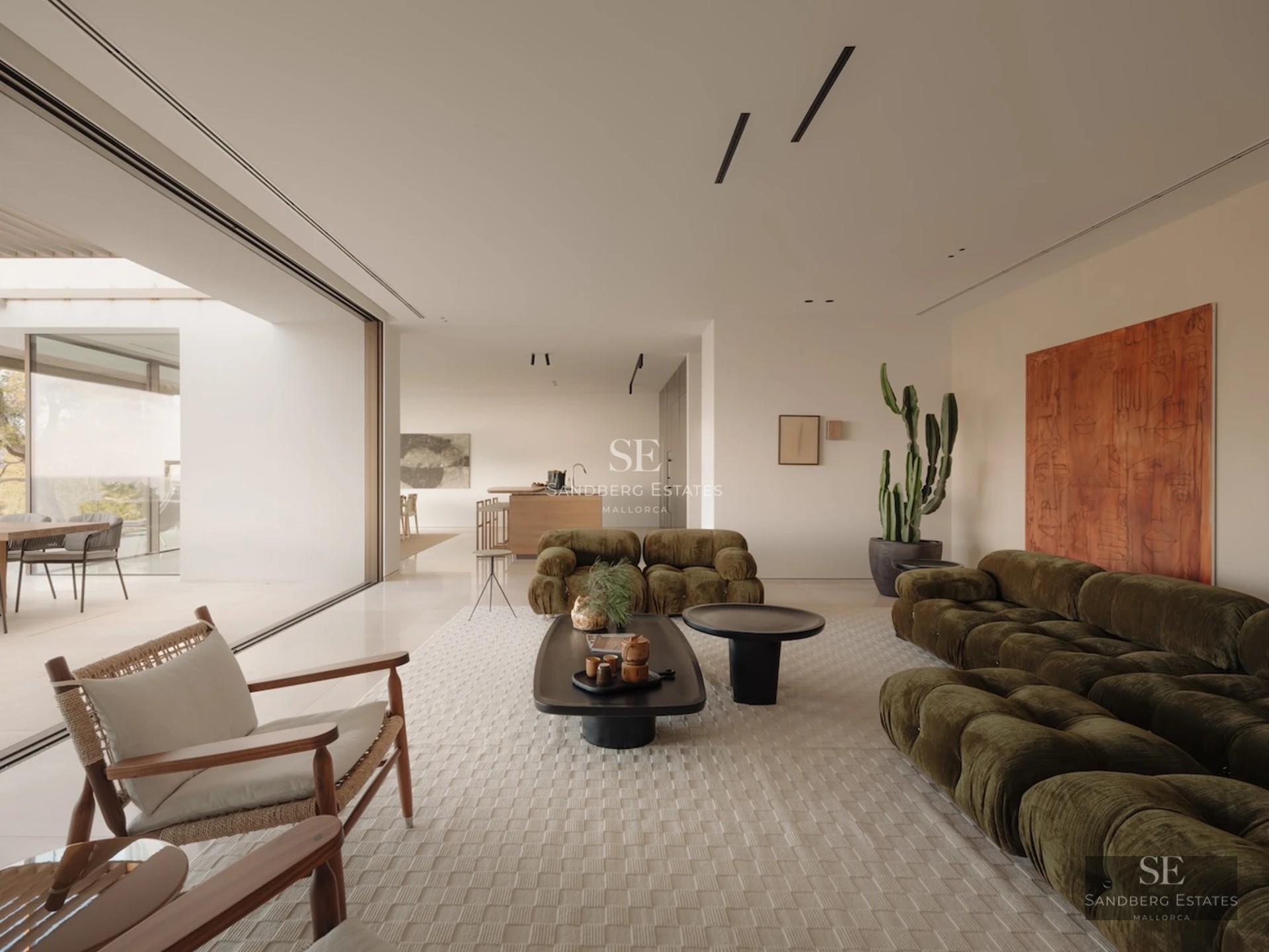 Exterior of modern villa featuring infinity pool, expansive terraces, ocean views, and contemporary architectural design.