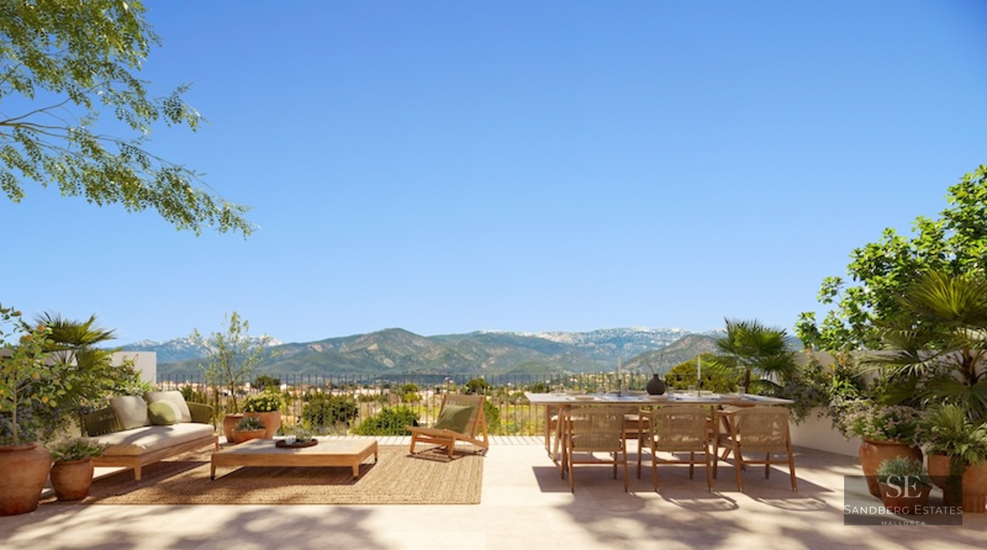 Spacious outdoor terrace with wooden dining set, lounge furniture, and panoramic views of distant mountains.