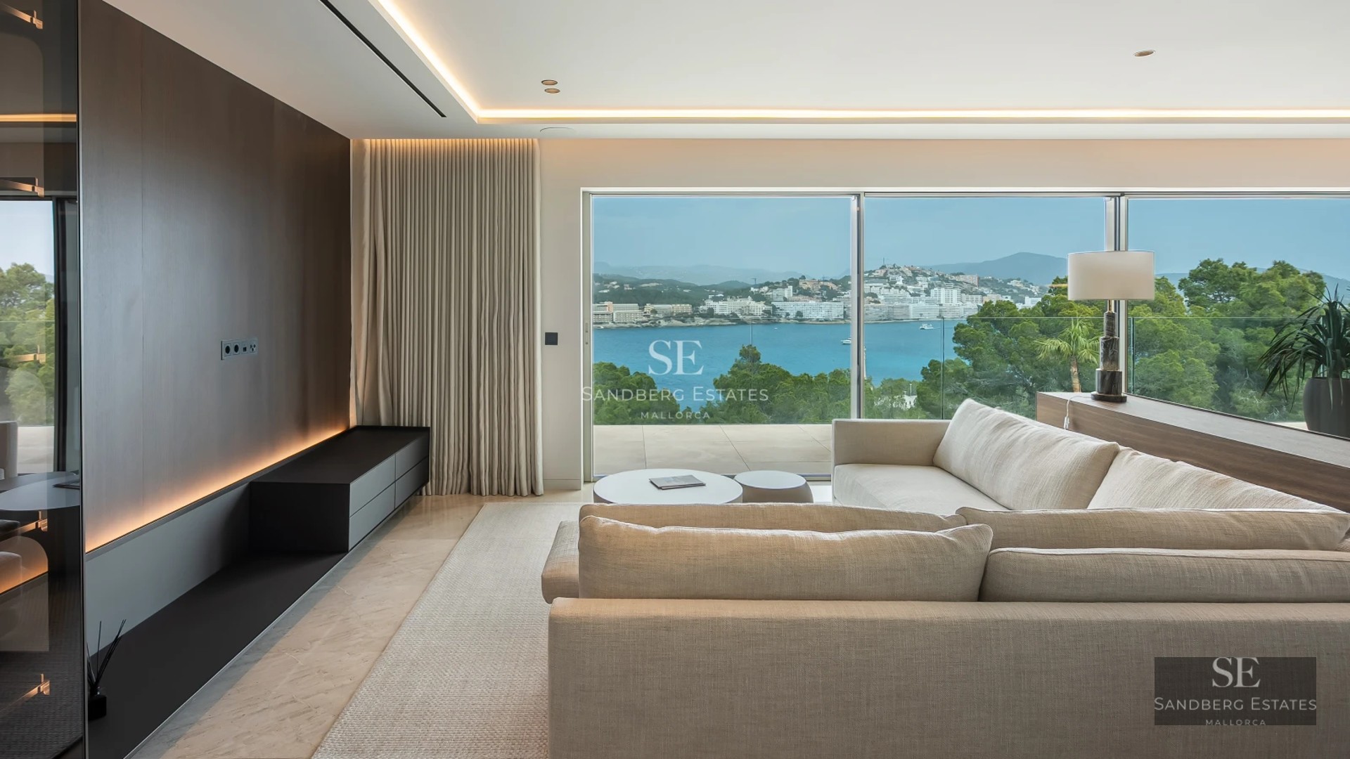 Modern exterior with infinity pool, spacious terraces, designer furniture, and lush greenery. Panoramic views.