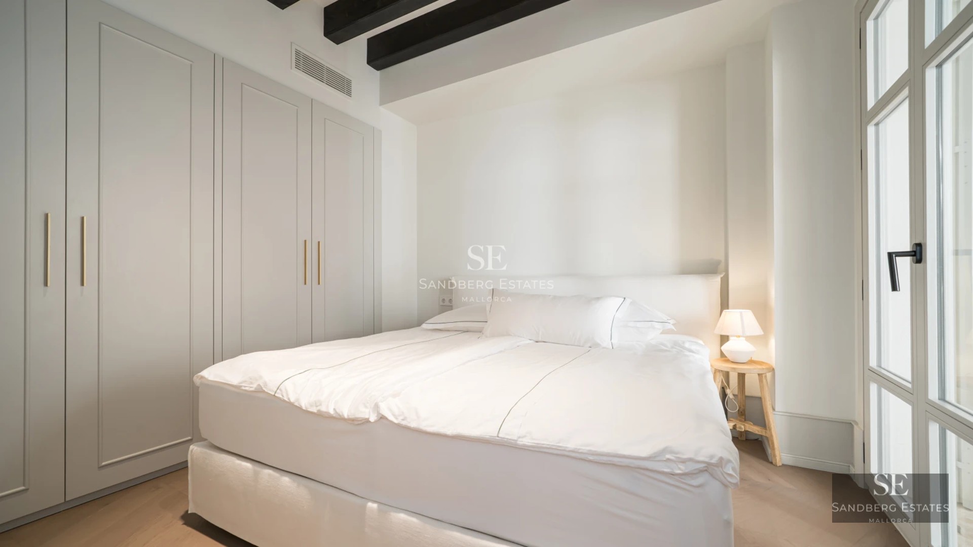 Expansive terrace featuring an infinity pool and panoramic views. Modern design, elegant furniture, lush vegetation.