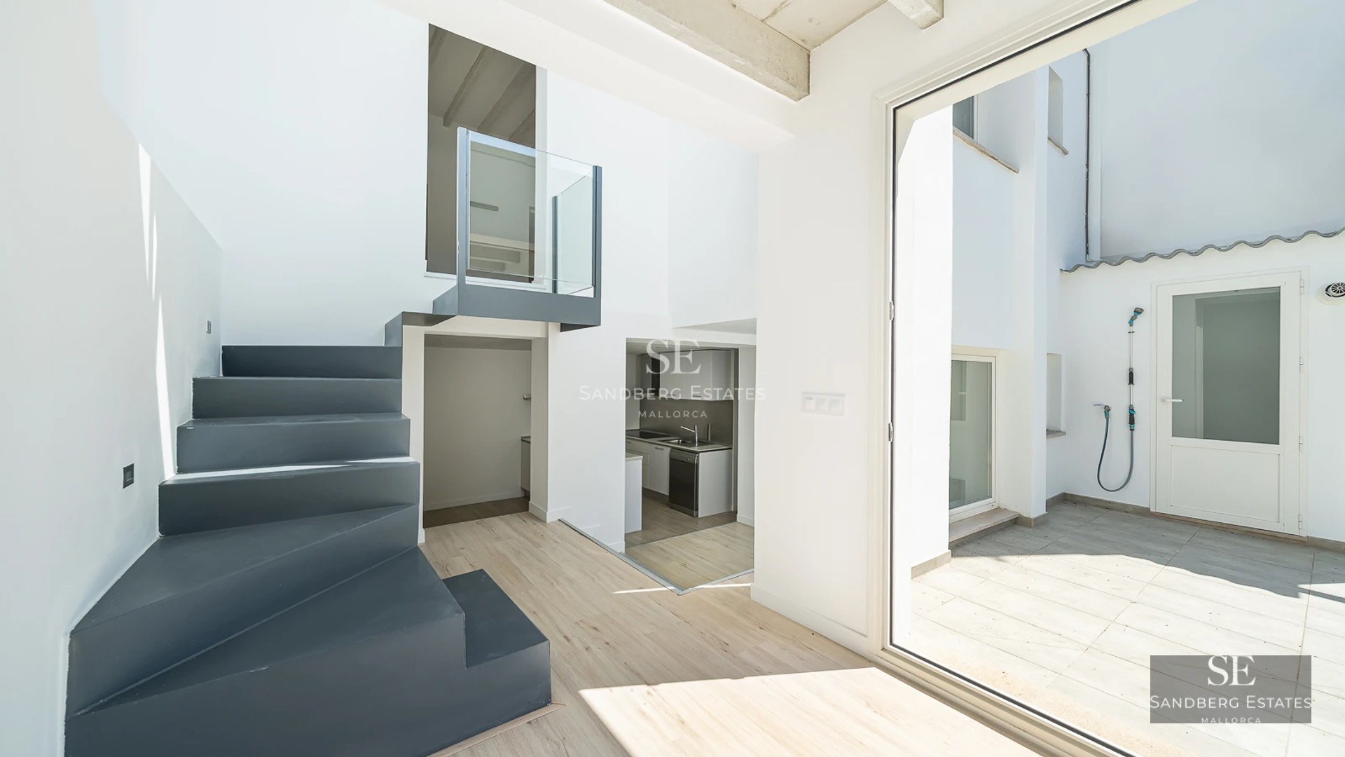 Spacious terrace with infinity pool, modern loungers, and panoramic views. Minimalist architecture with natural touches.