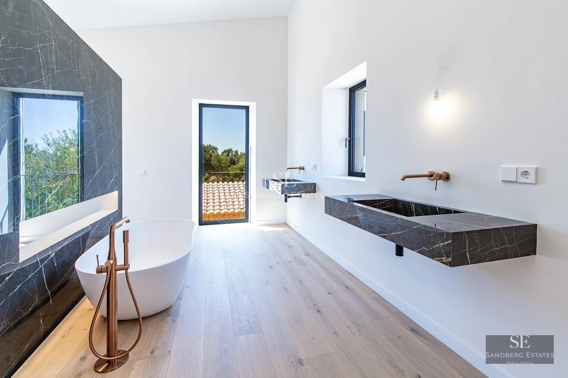 Spacious living room with picture windows, modern fireplace, designer furniture, and unobstructed views. Abundant natural light.