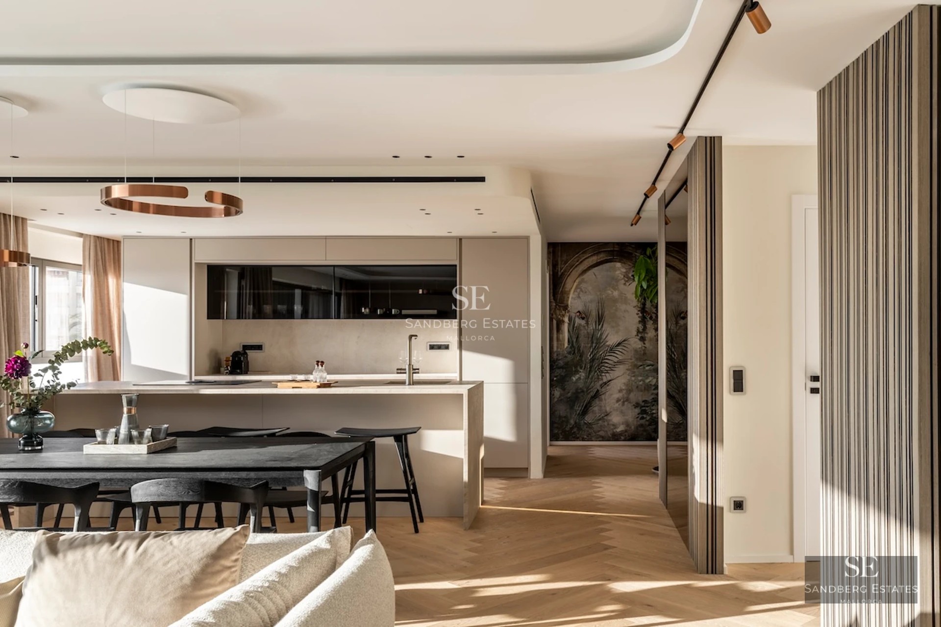 Exterior view of a modern villa featuring a reflecting pool, lush garden, and minimalist architecture. Large windows and abundant natural light.