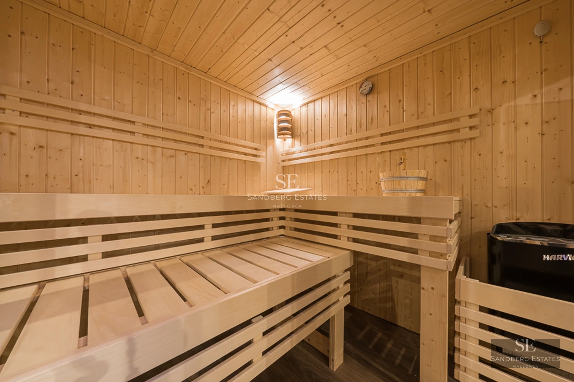 Spacious living room with large windows, outdoor pool, and modern furniture. Natural lighting and unobstructed views.