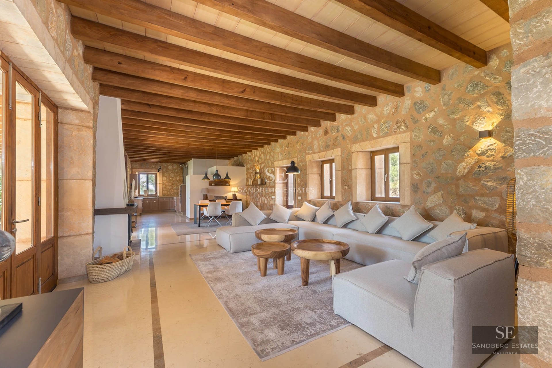 Expansive terrace featuring an infinity pool, sun loungers, and panoramic views. Modern, minimalist design with touches of greenery.