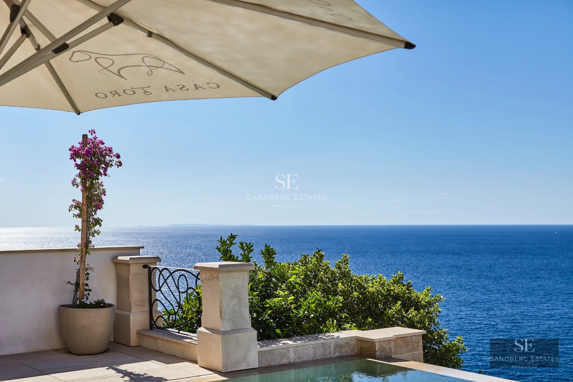 Exterior of a modern villa with infinity pool, large terraces, and panoramic sea views. Sleek and minimalist design.