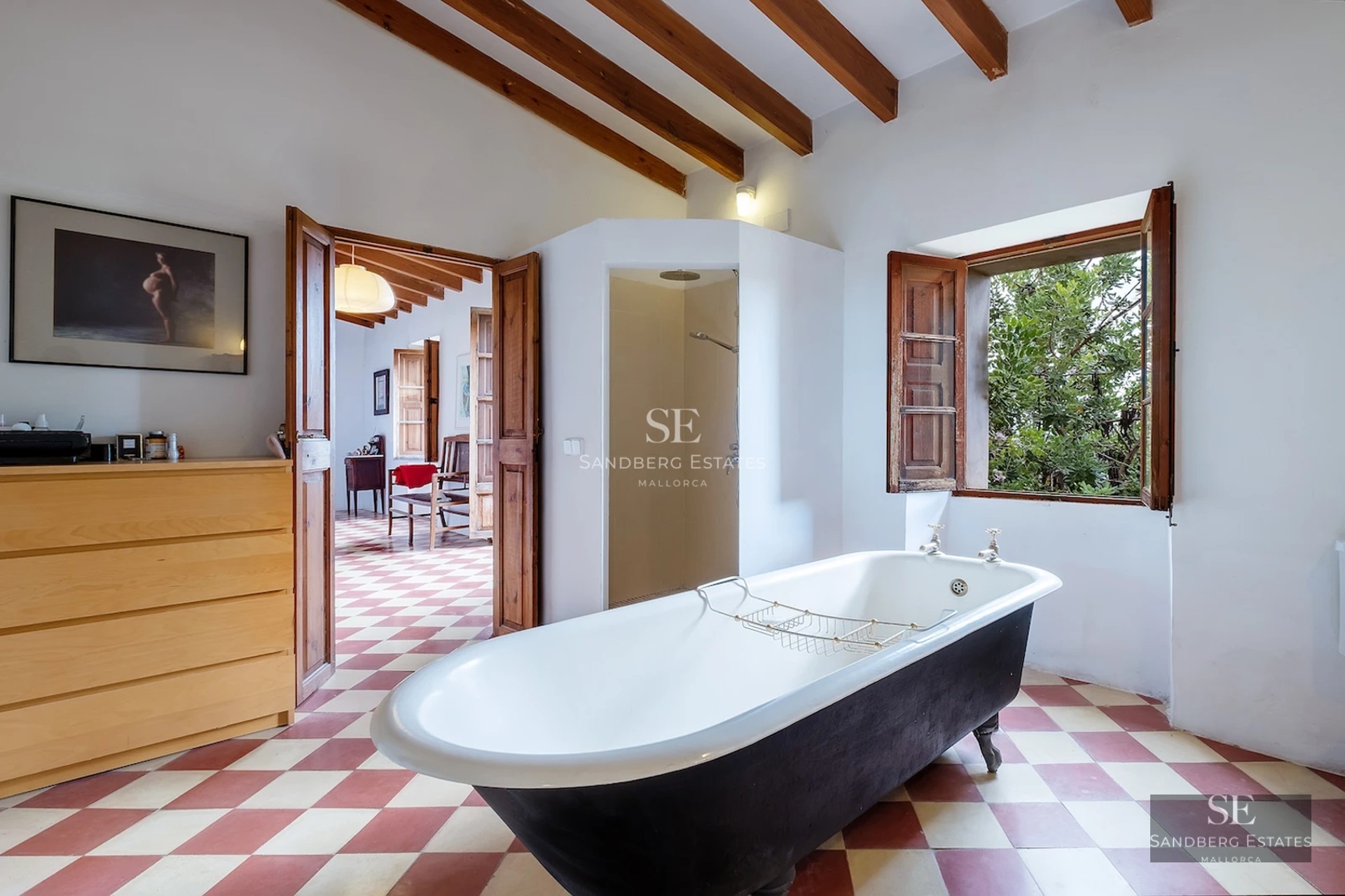 Spacious balcony with sea view. Modern design, glass railing, tiled floor, and outdoor furniture. Bright and airy.