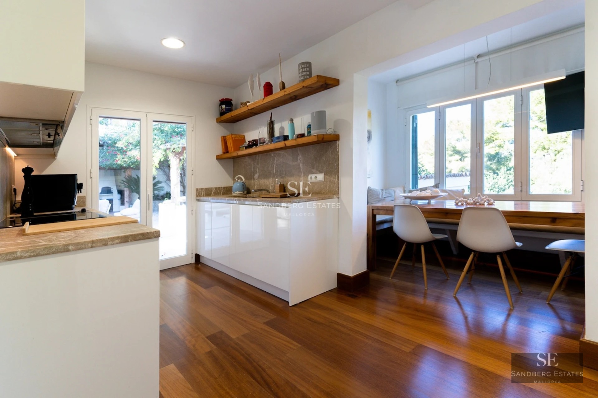 Spacious terrace with infinity pool, sun loungers and panoramic views. Modern design with clean lines and natural materials.