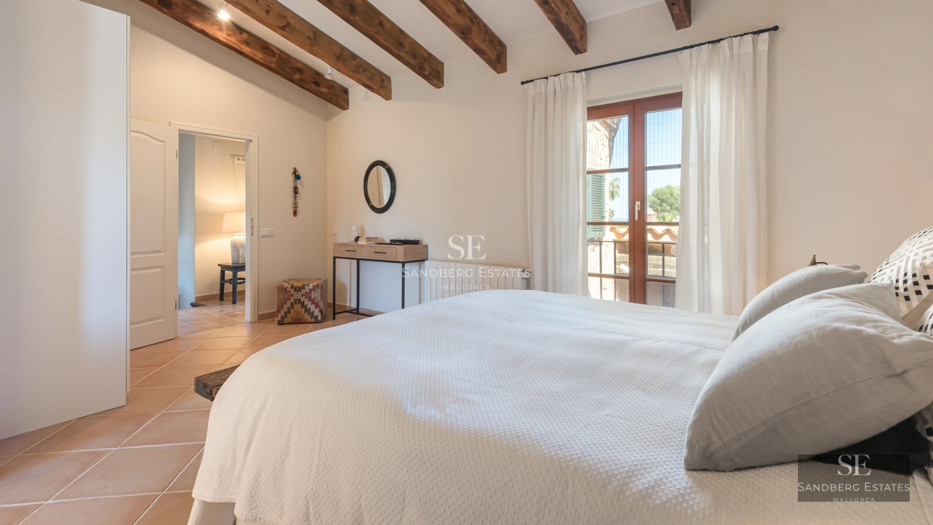 Spacious terrace with infinity pool, sun loungers, and panoramic sea views. Modern and minimalist design.