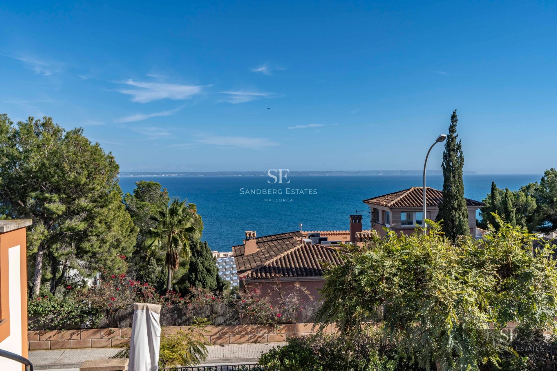 Spacious terrace with infinity pool, sun loungers, and panoramic views. Modern design with high-quality finishes.