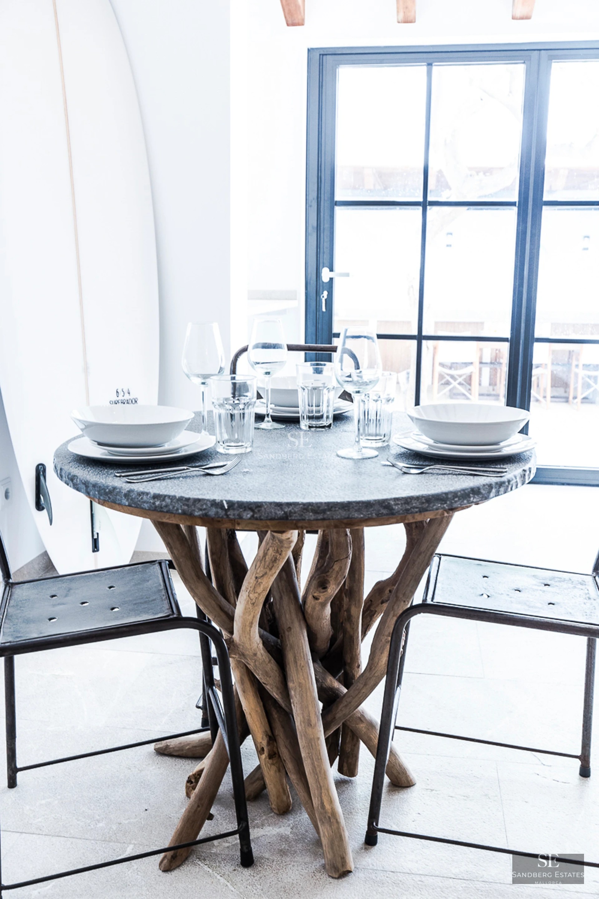 Spacious terrace with infinity pool, sun loungers, and panoramic views. Modern design featuring glass railing and lush greenery.