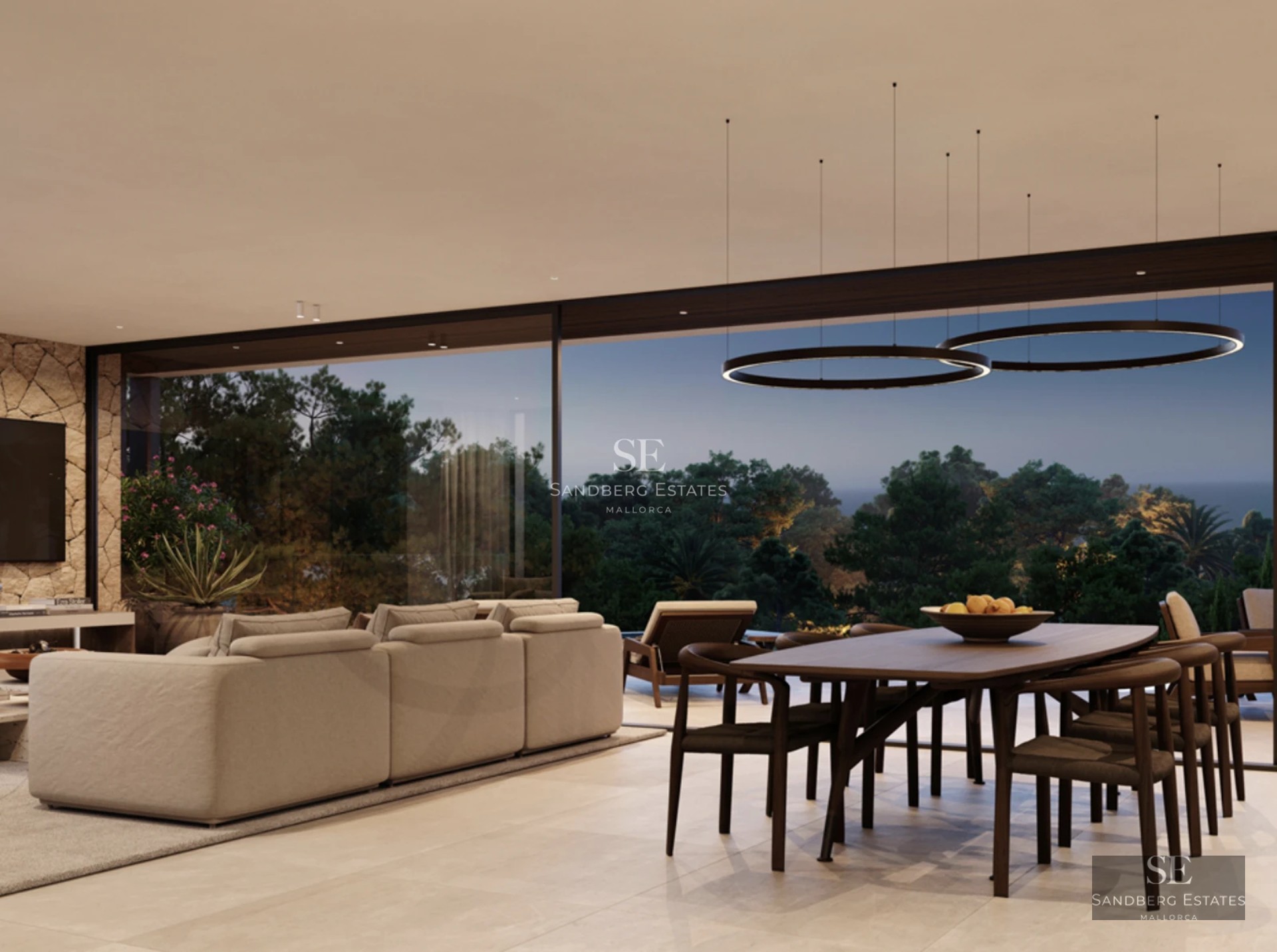 Large pool bordered by an elegant terrace with sun loungers. Modern architecture with large windows and lush vegetation.