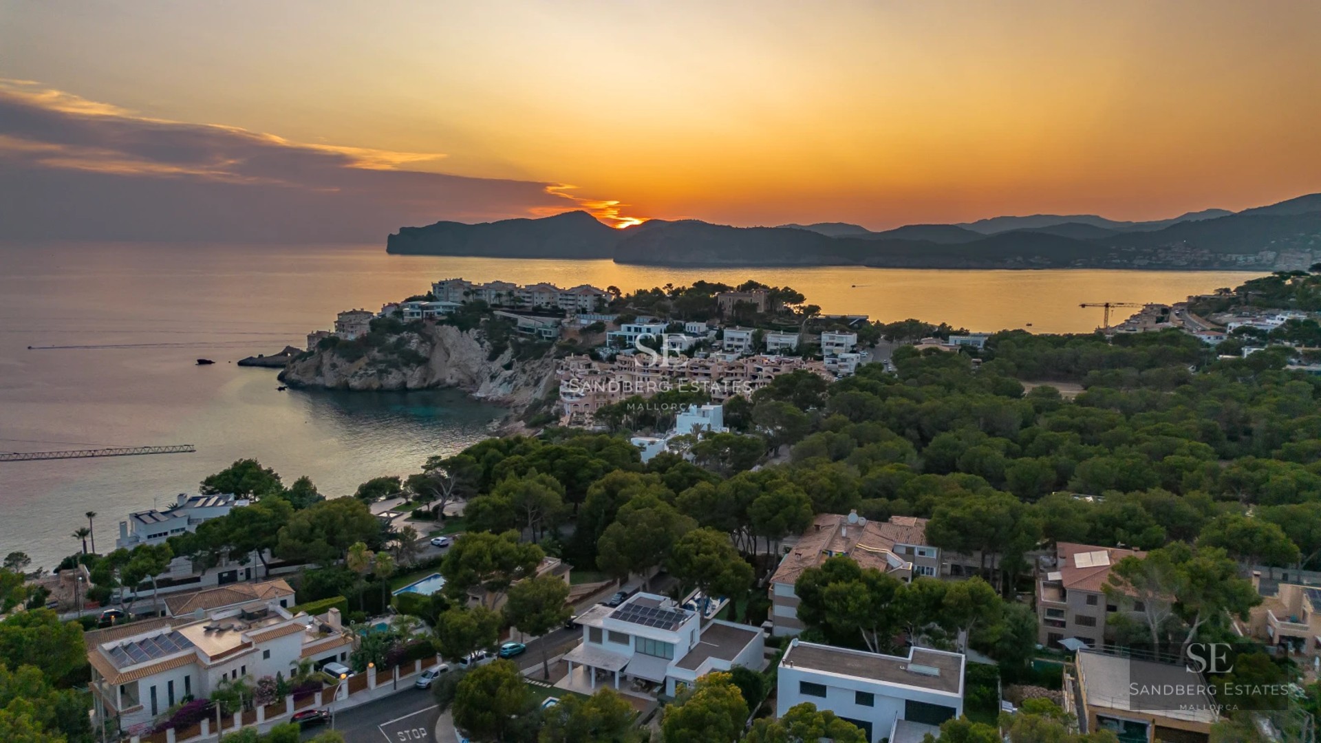 View of a modern villa with infinity pool. Minimalist design, large windows, and lush gardens. Luxurious and tranquil atmosphere.