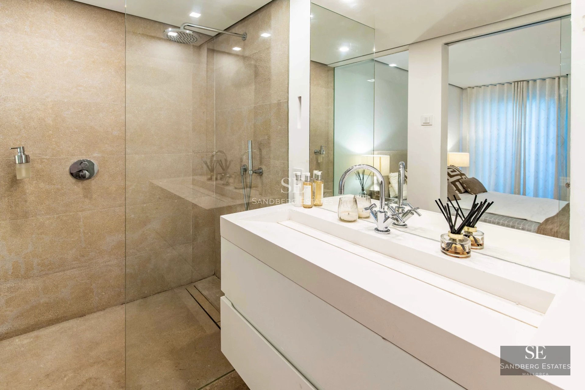 Spacious terrace with infinity pool, sun loungers, and panoramic views. Modern design featuring clean lines and high-end materials.