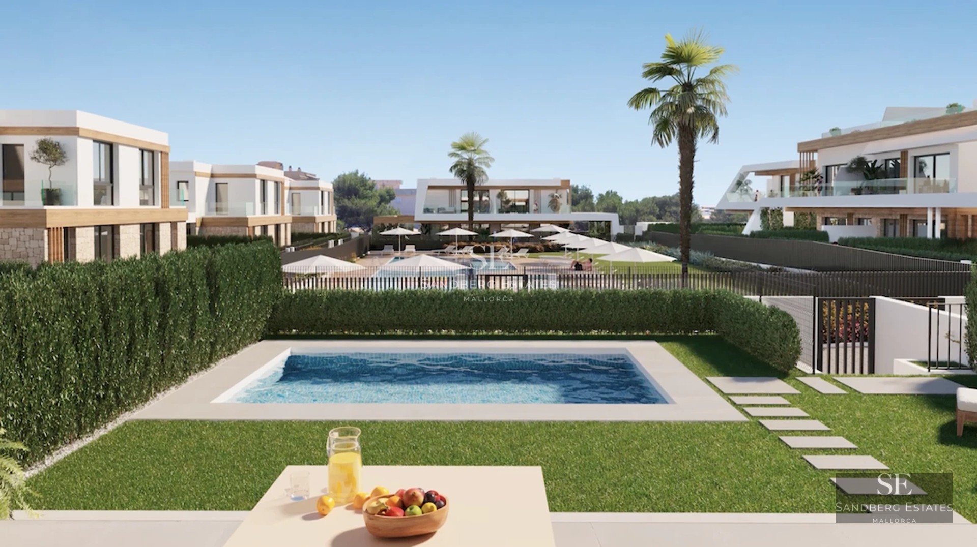 Modern balcony with glass railing, panoramic sea view, outdoor furniture, and minimalist design.