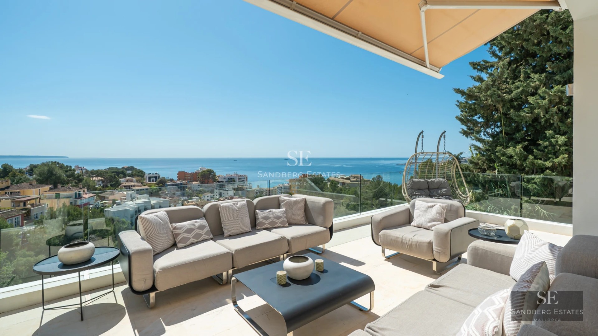 Exterior of modern villa with reflecting pool, minimalist design, large windows, and lush vegetation.