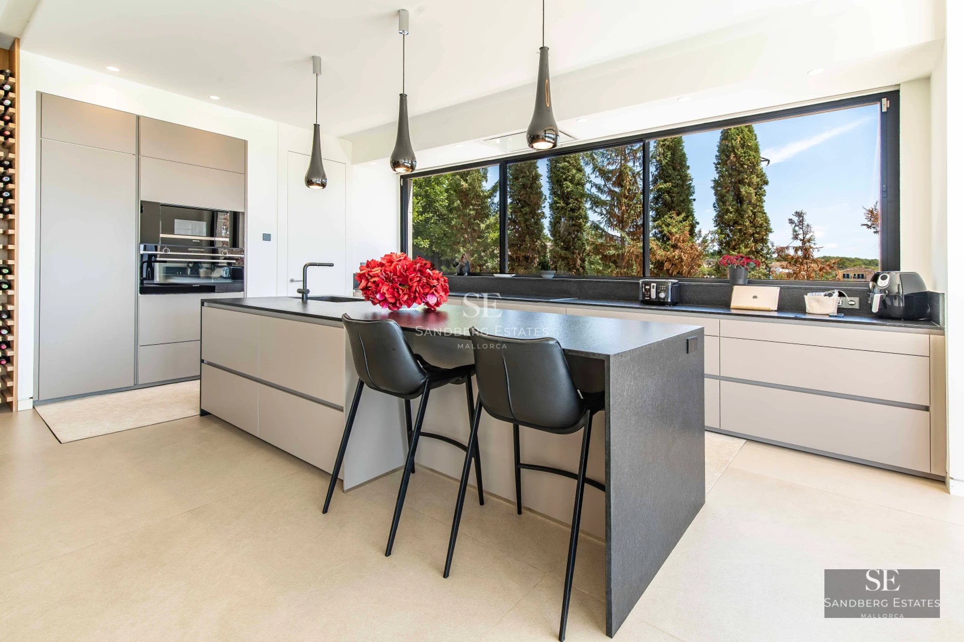 Spacious terrace with infinity pool, sun loungers and panoramic views. Modern design with wooden floors and glass railing.