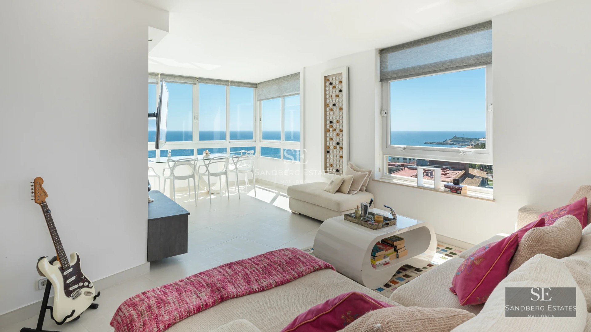 Exterior view of a modern villa featuring an infinity pool, large windows, and lush gardens. Minimalist architecture and elegant design.