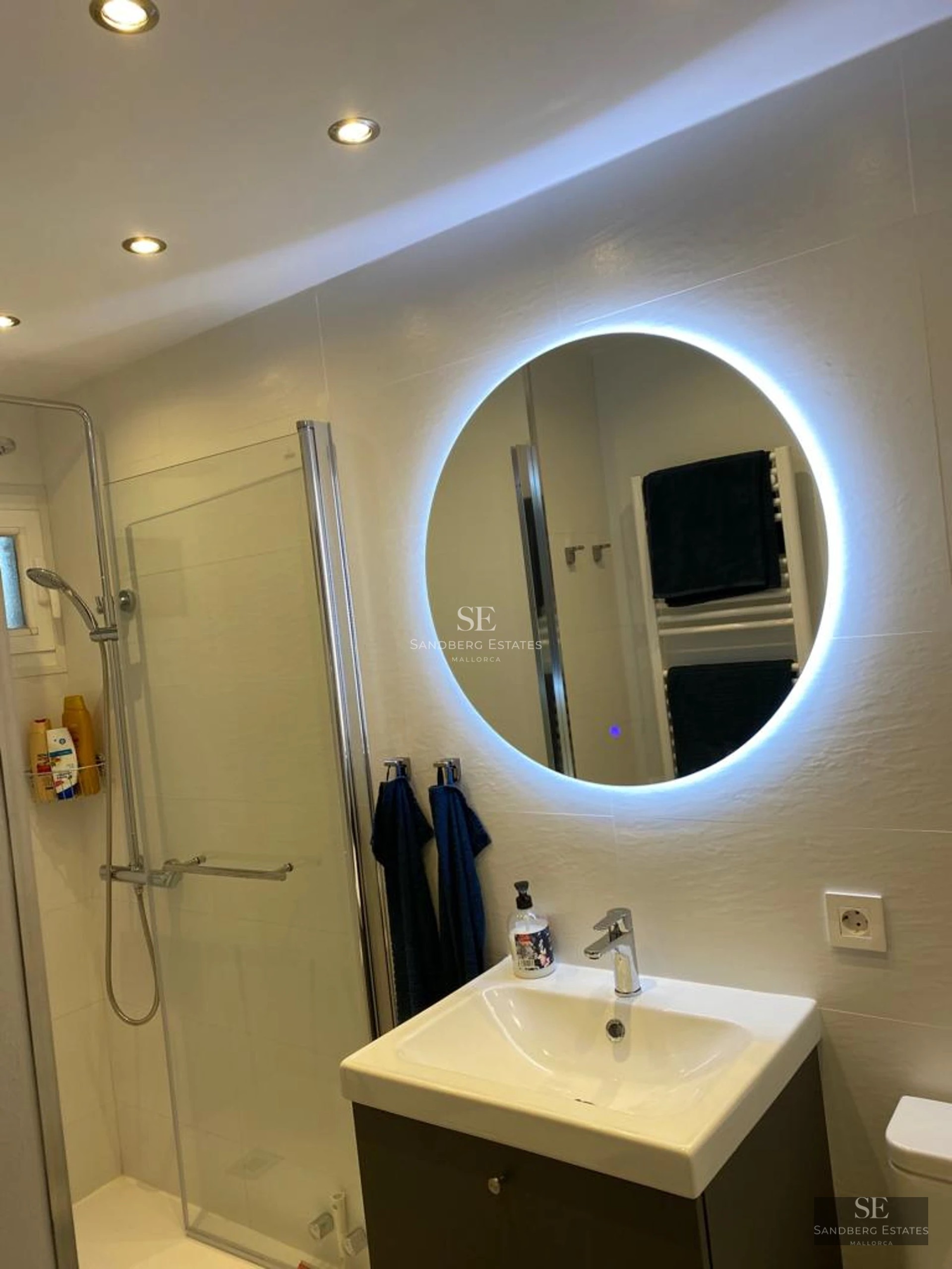 Exterior of a modern villa featuring a pool, large windows, and lush garden. Contemporary architecture and landscaping.