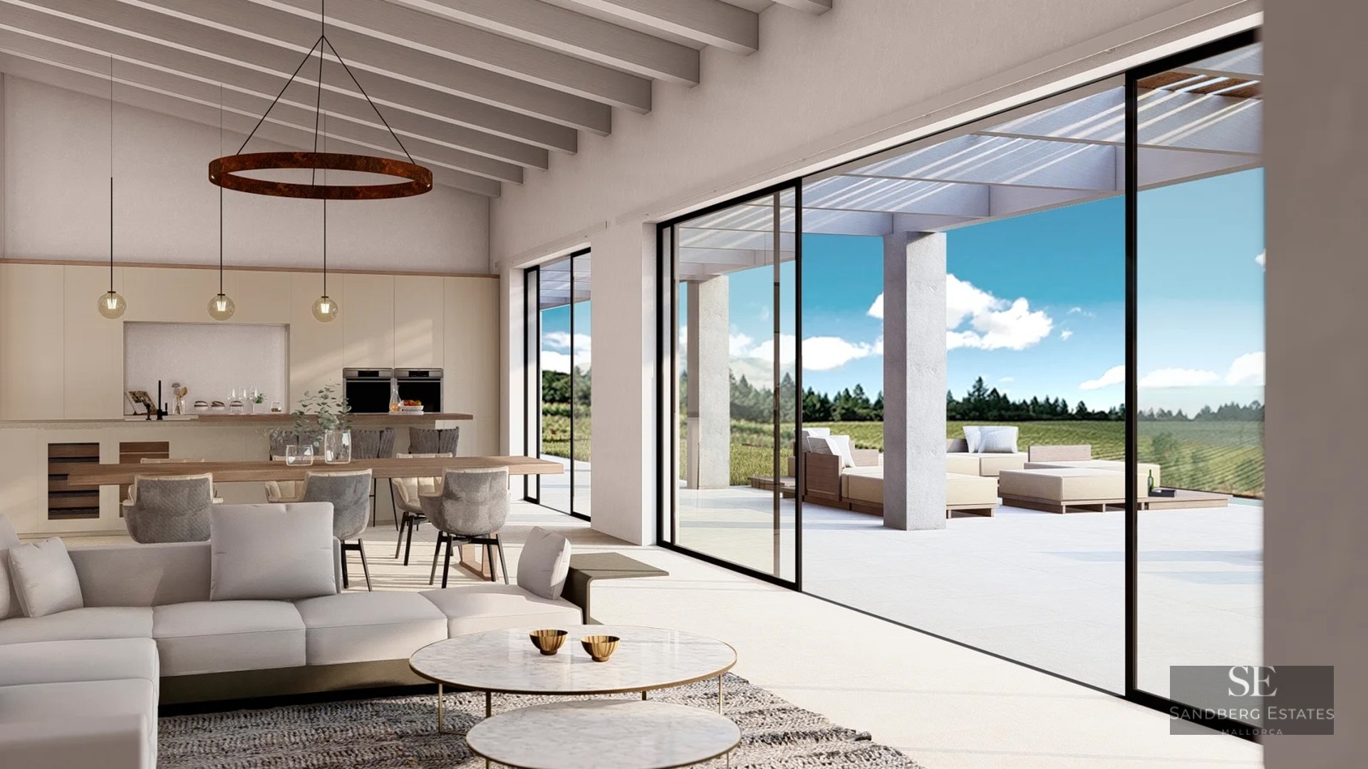Bright living room with wooden beams, modern sofas, and large glass sliding doors opening to a sunny terrace.