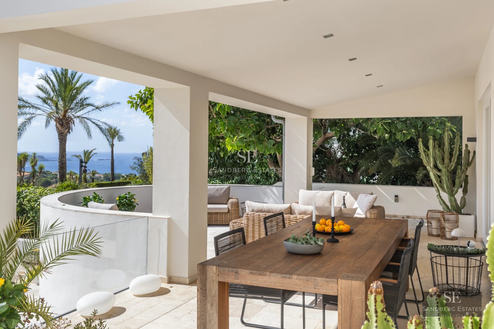 Expansive terrace with infinity pool and panoramic views. Modern design featuring wood flooring, sun loungers, and minimalist architecture.