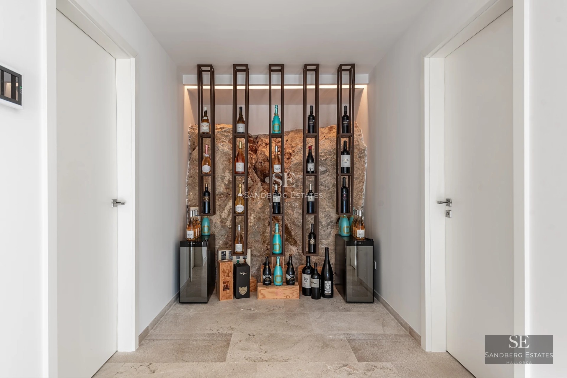 Expansive terrace with infinity pool, sun loungers, and panoramic views. Modern, elegant design ideal for relaxation.